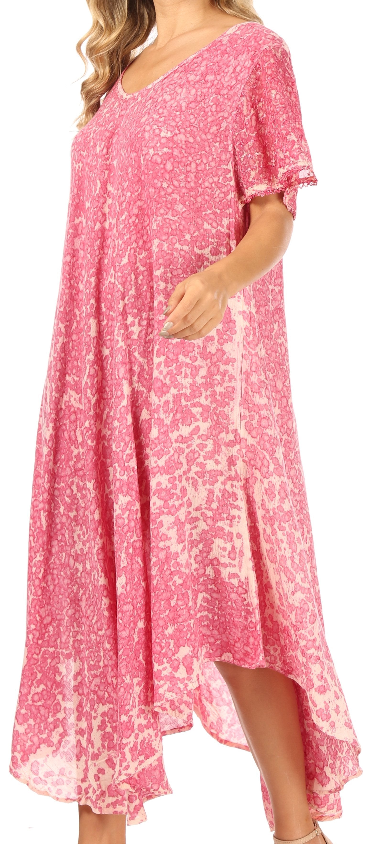 Pink floral dress worn by a person, with a focus on the garment.