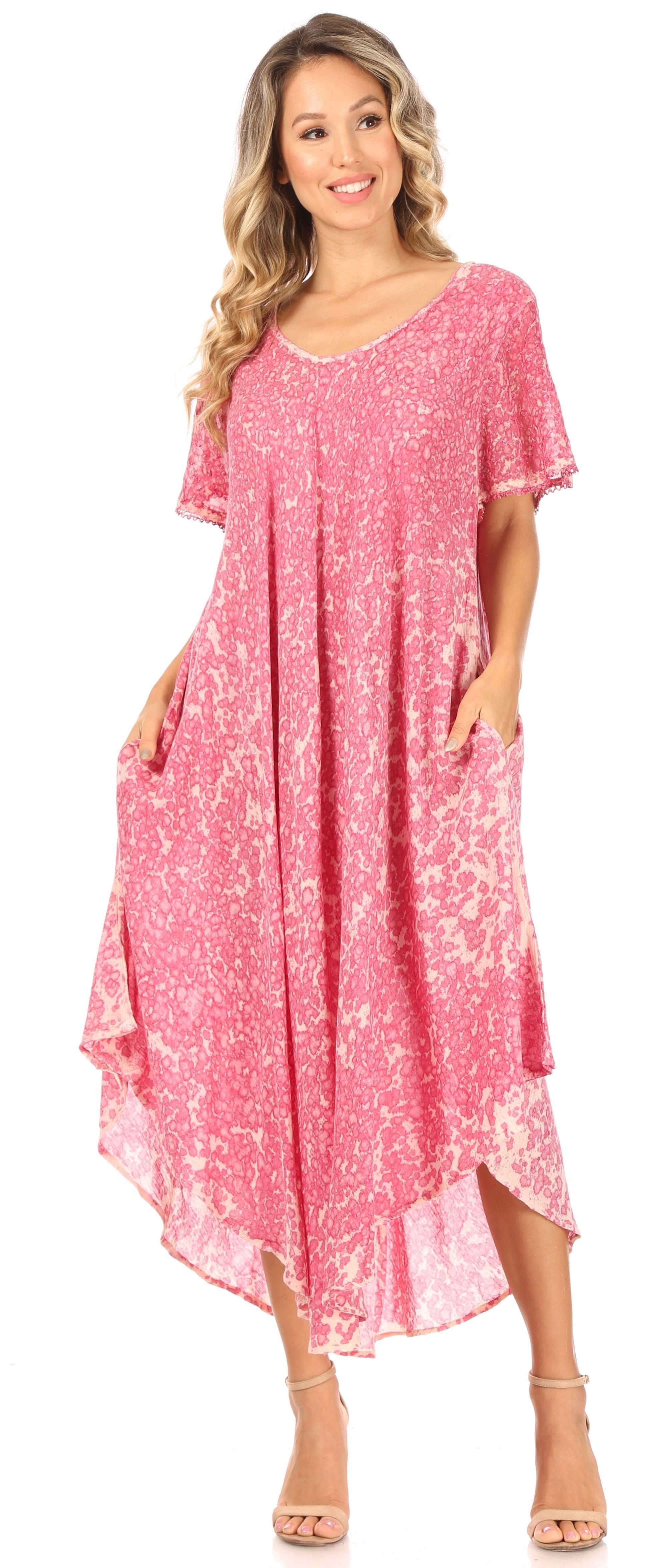 Woman wearing a pink floral dress on a white background