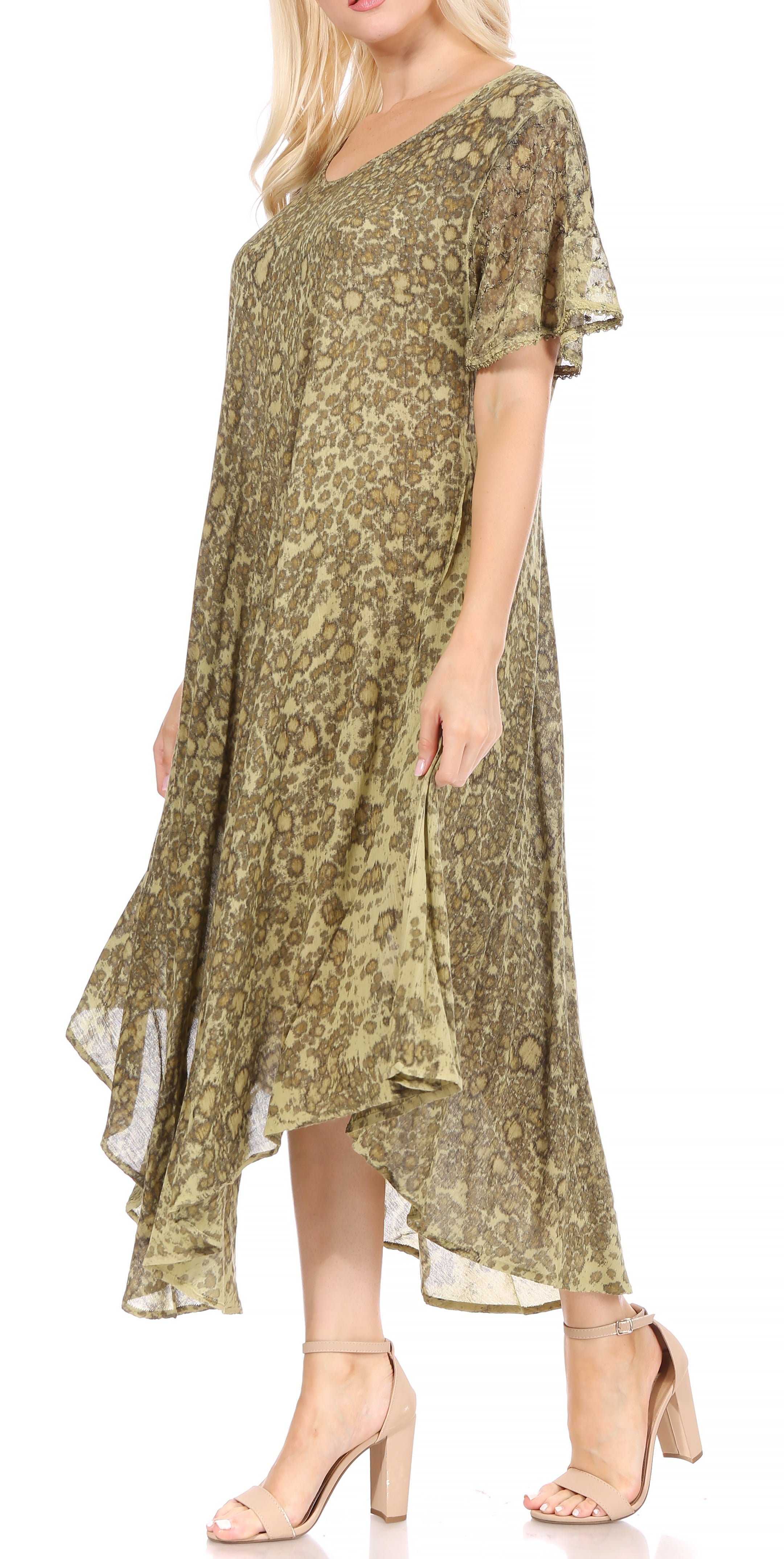 Woman wearing a green floral dress on a white background