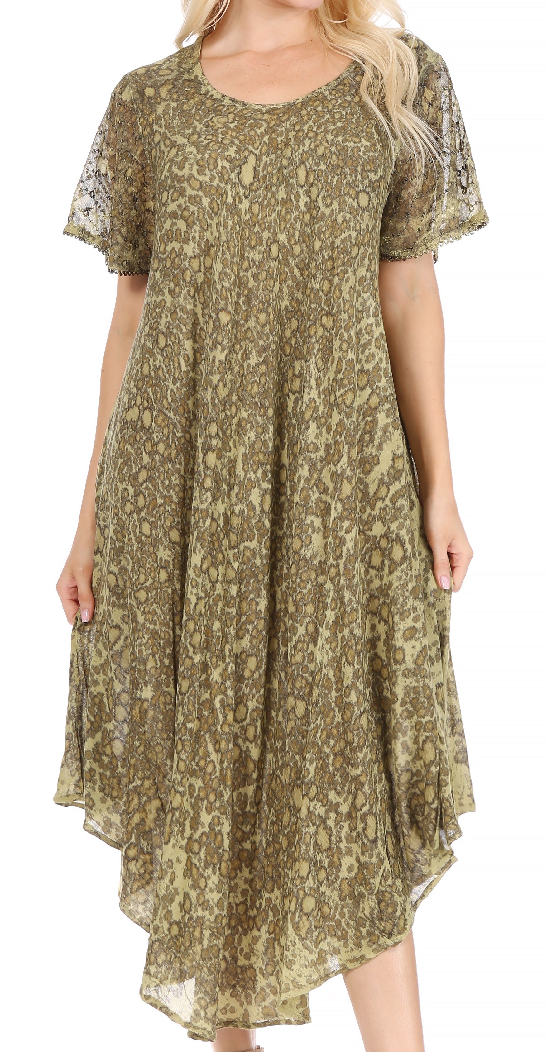 Woman wearing a green patterned dress on a white background