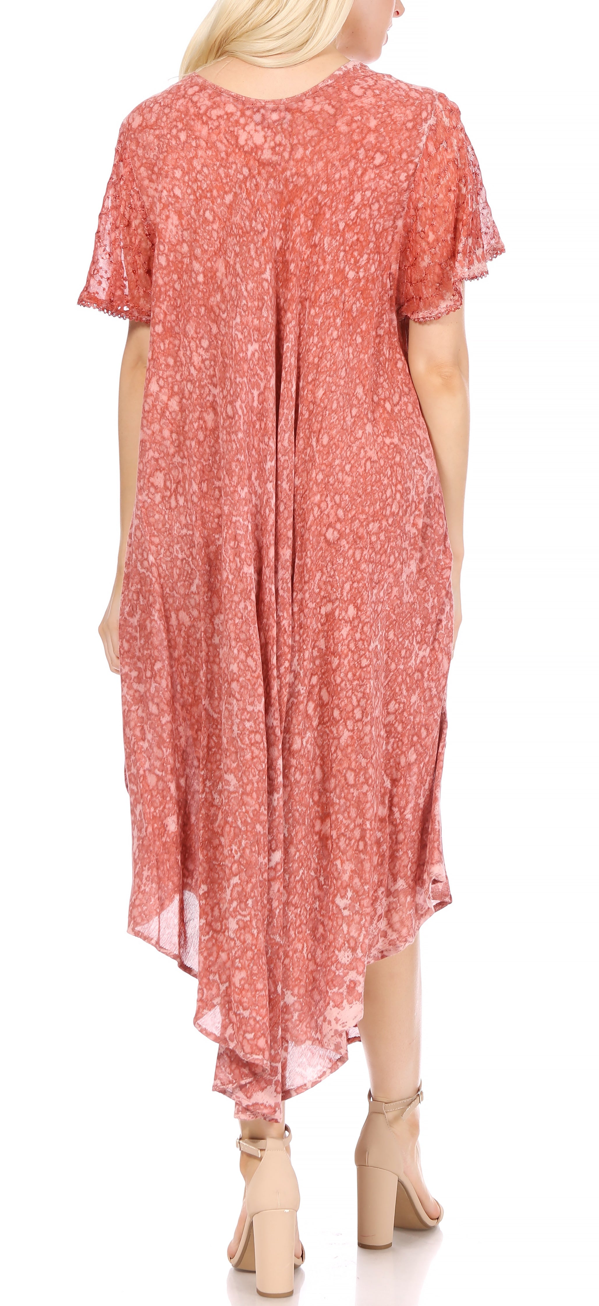 Woman wearing a red floral dress on a white background