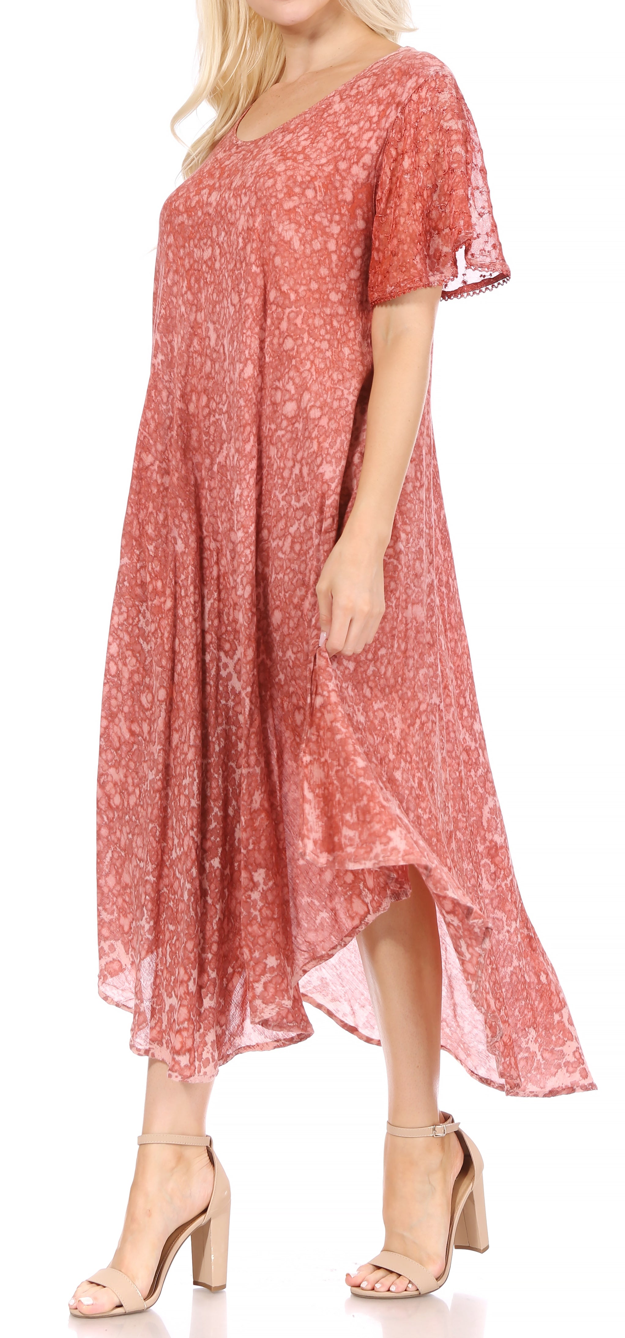 Woman wearing a red floral dress on a white background
