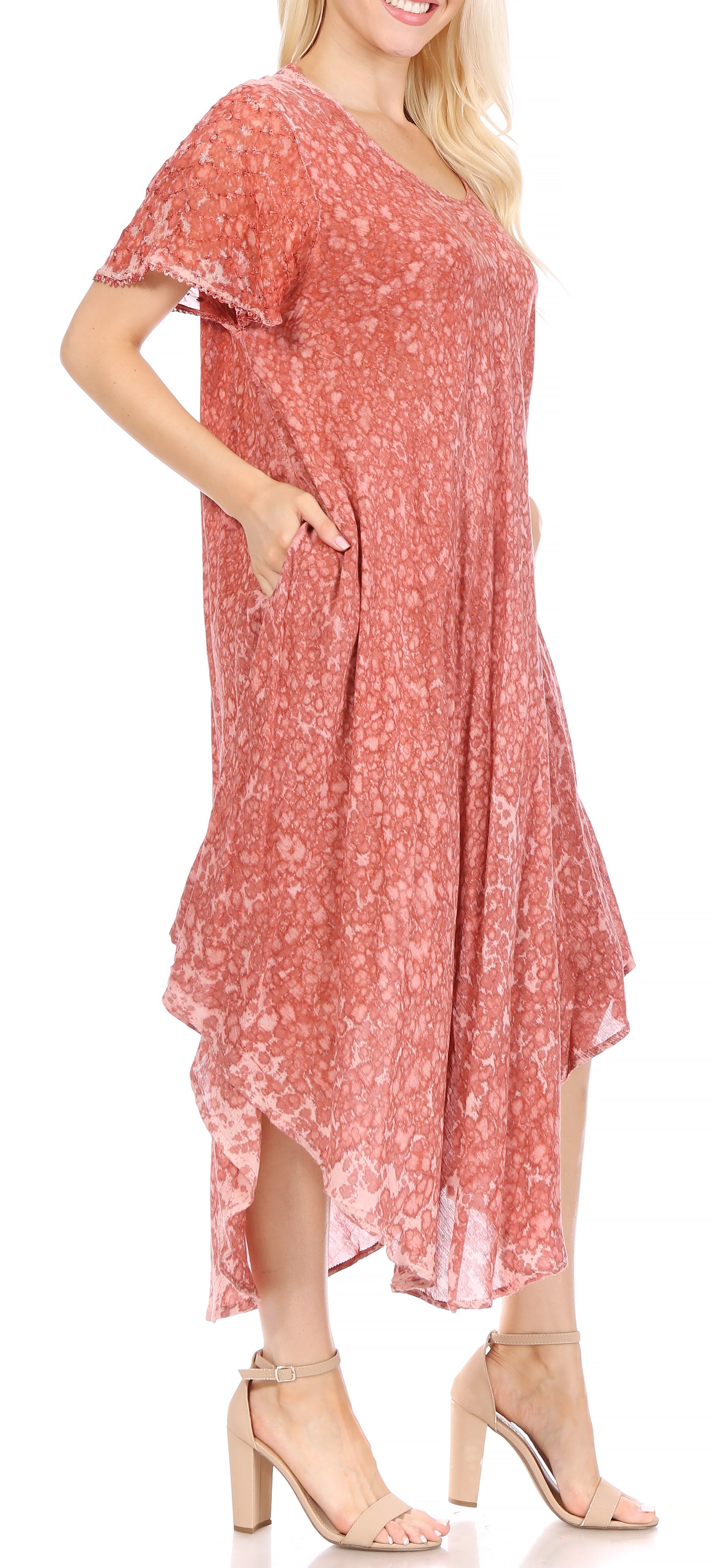 Woman wearing a pink floral dress on a white background