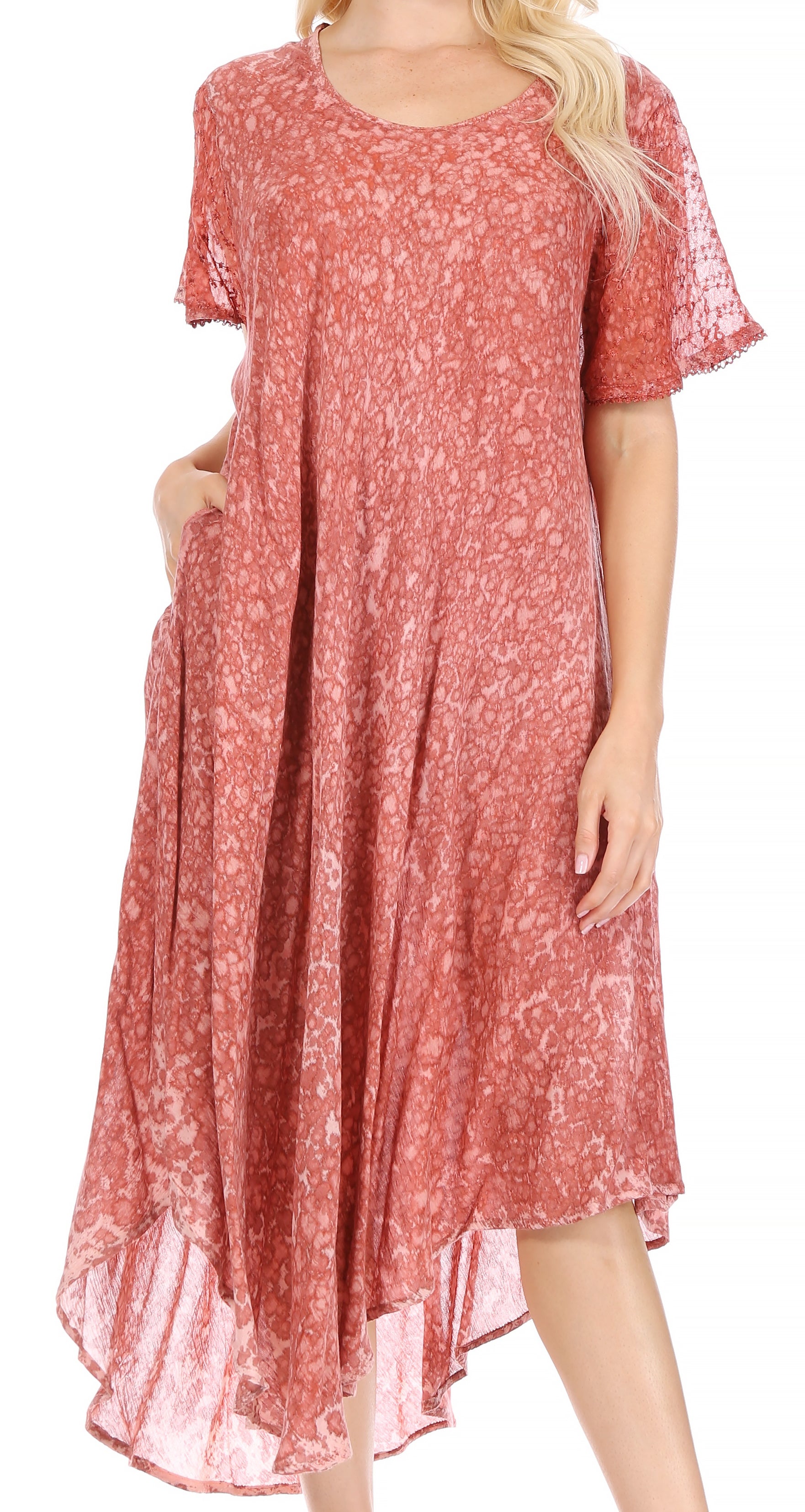 Red patterned dress worn by a model on a white background