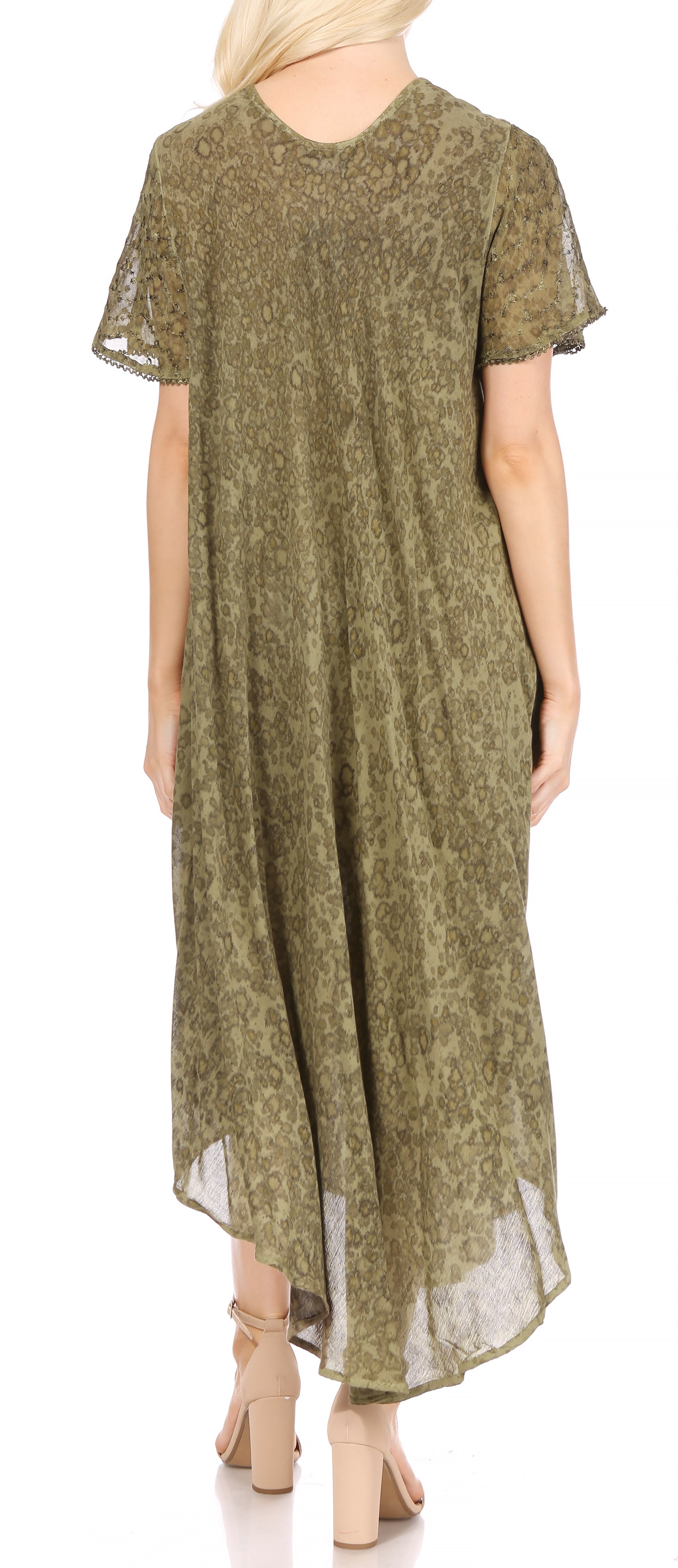 Woman wearing a green patterned dress on a white background