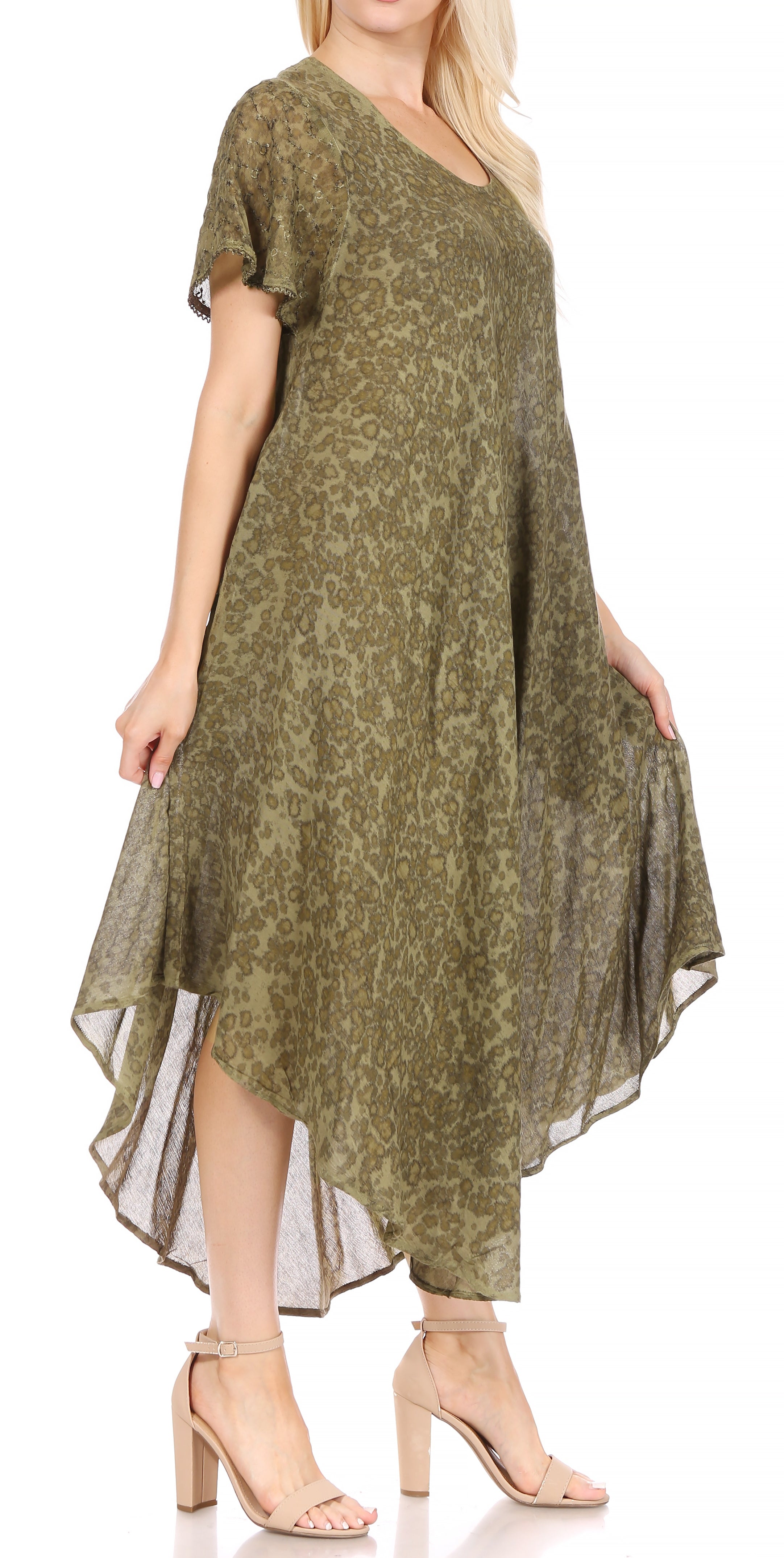 Woman wearing a green floral dress on a white background