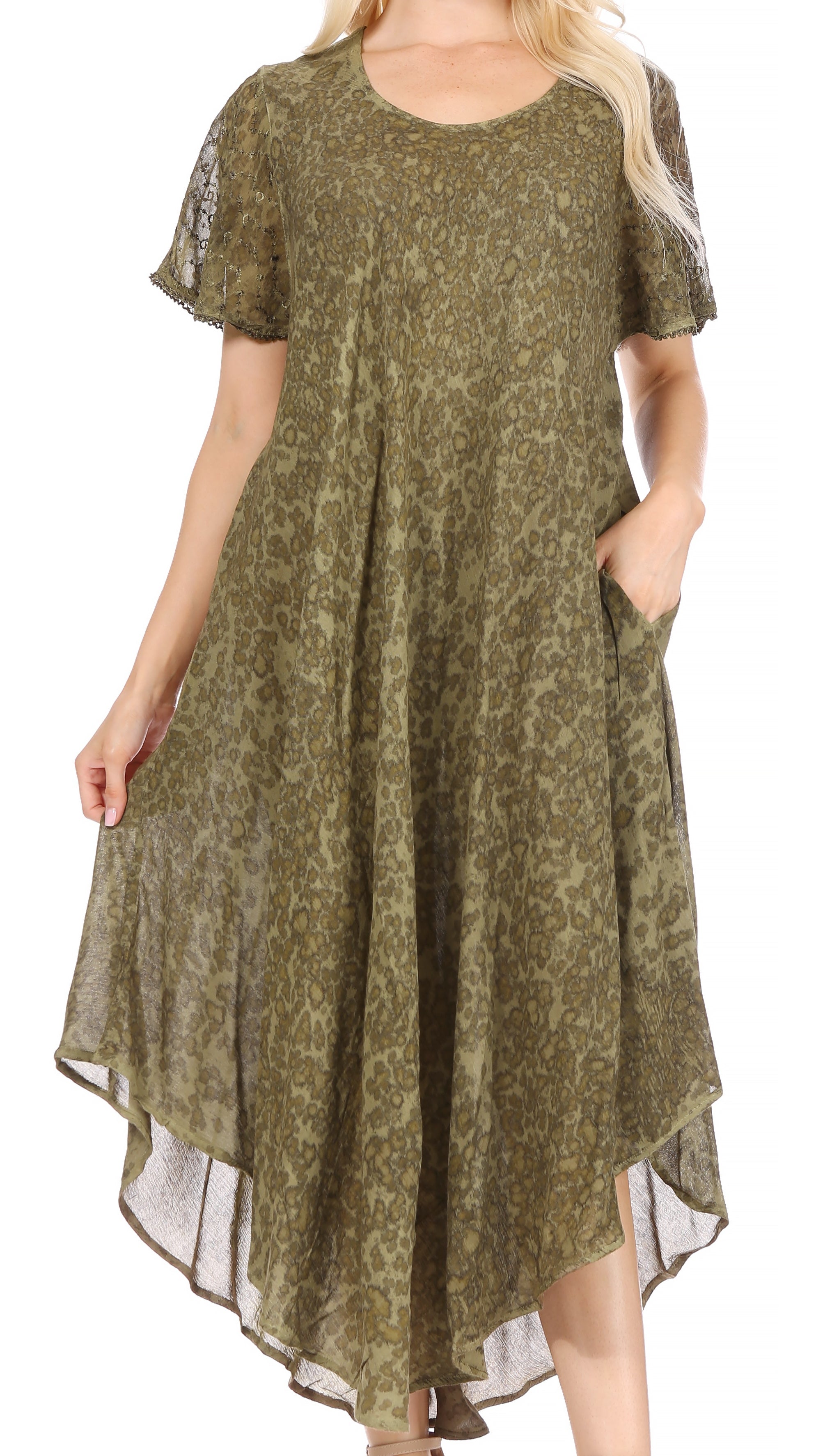 Woman wearing a green patterned dress on a white background