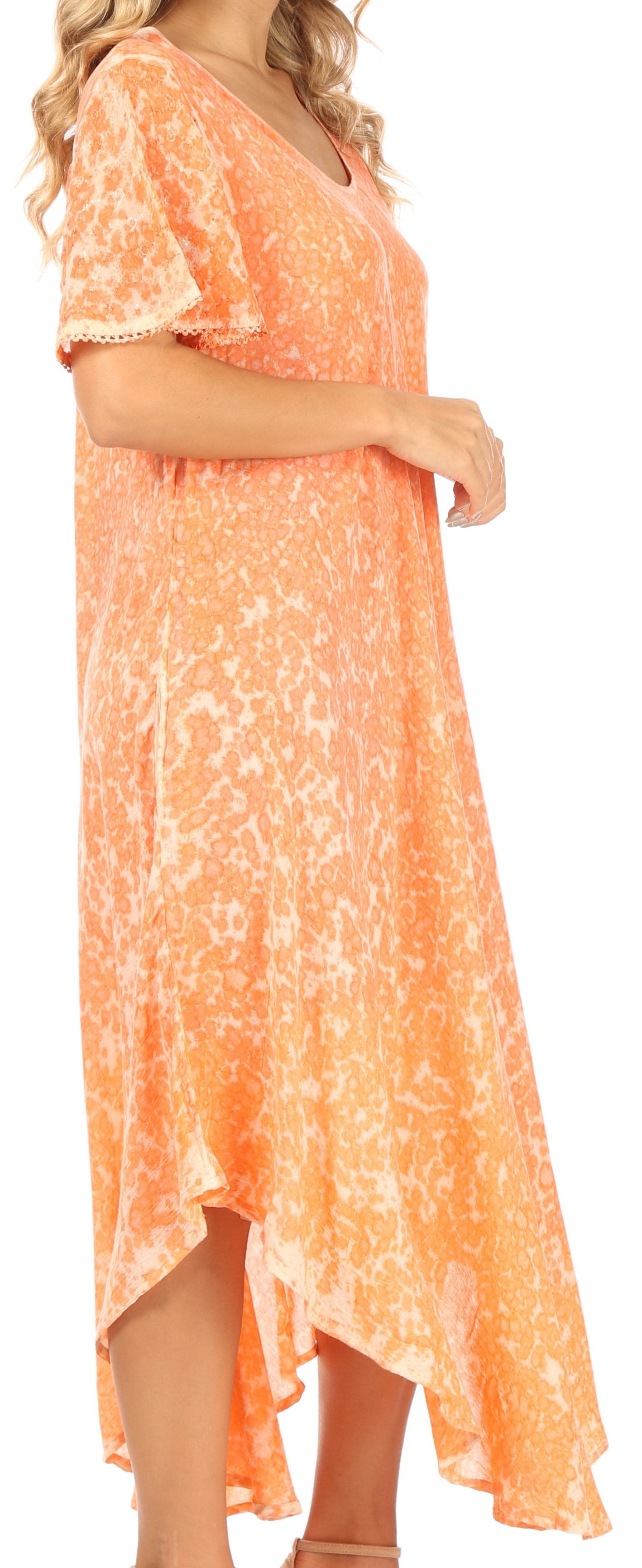Woman wearing an orange floral dress on a white background