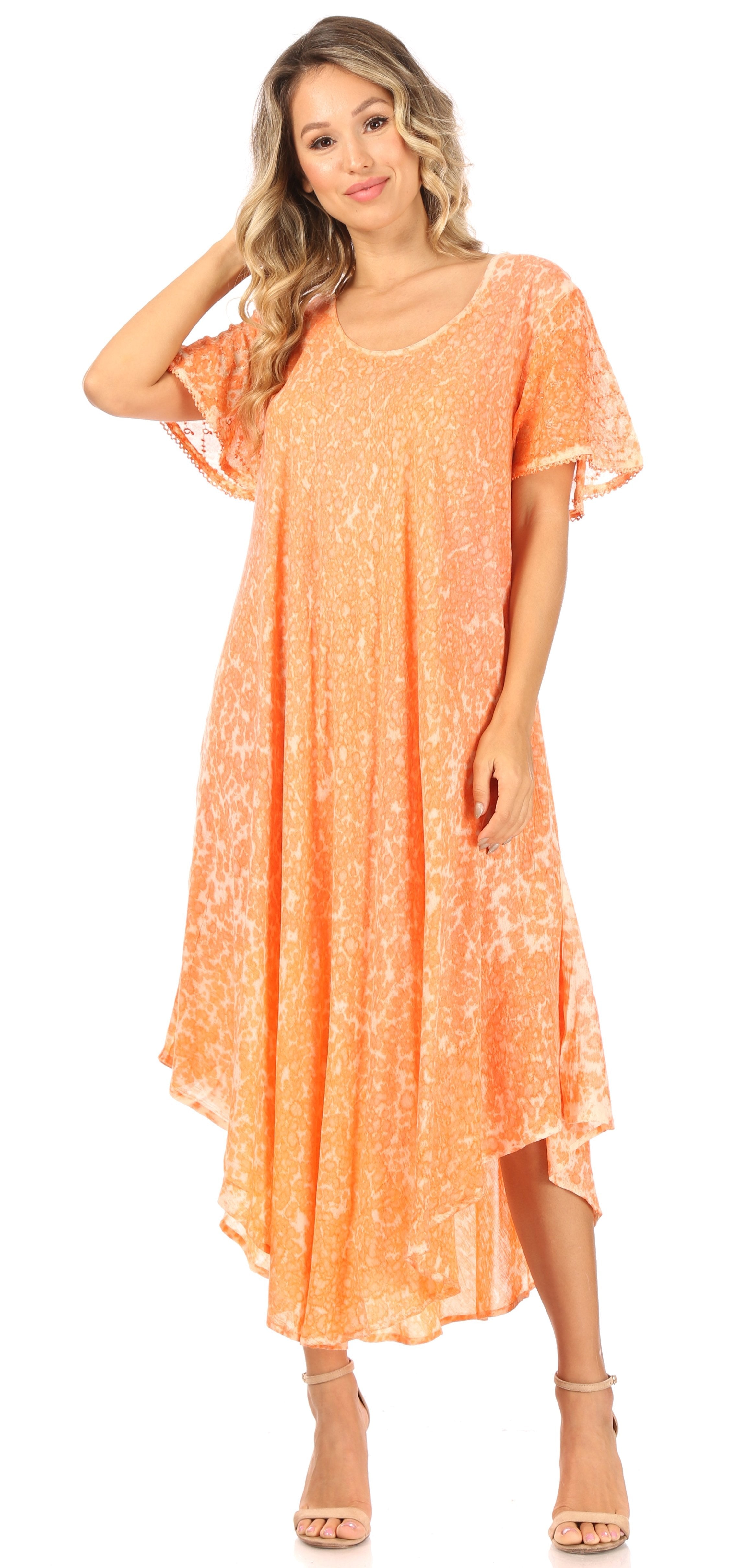 Woman wearing an orange floral dress on a white background