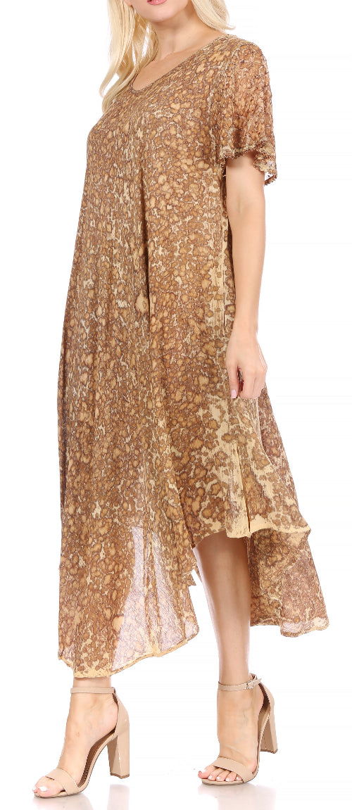 Woman wearing a gold floral dress on a white background