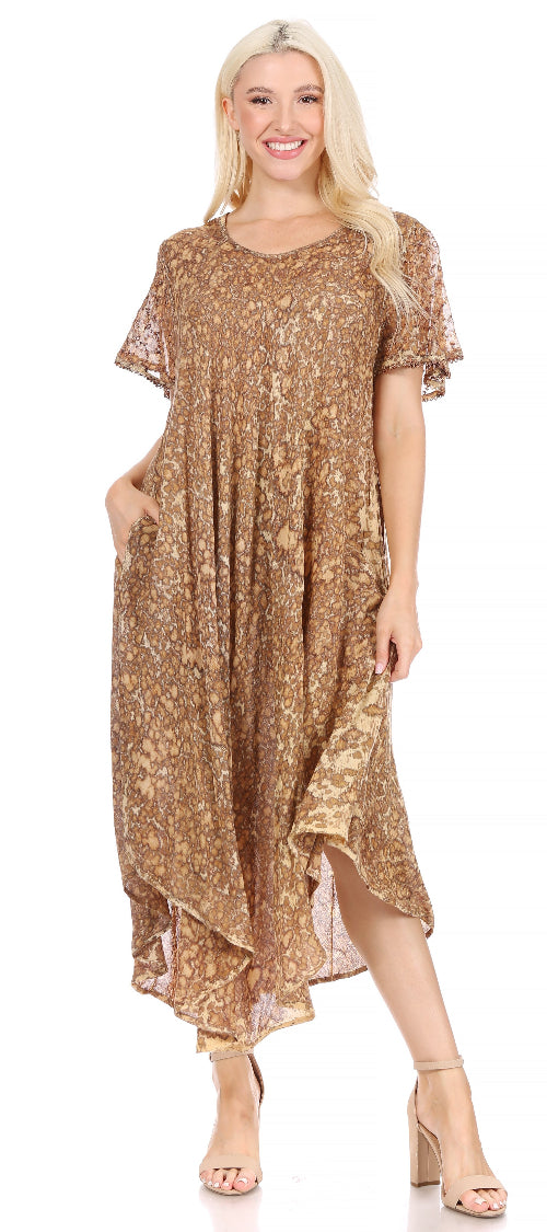 Woman wearing a gold floral dress on a white background