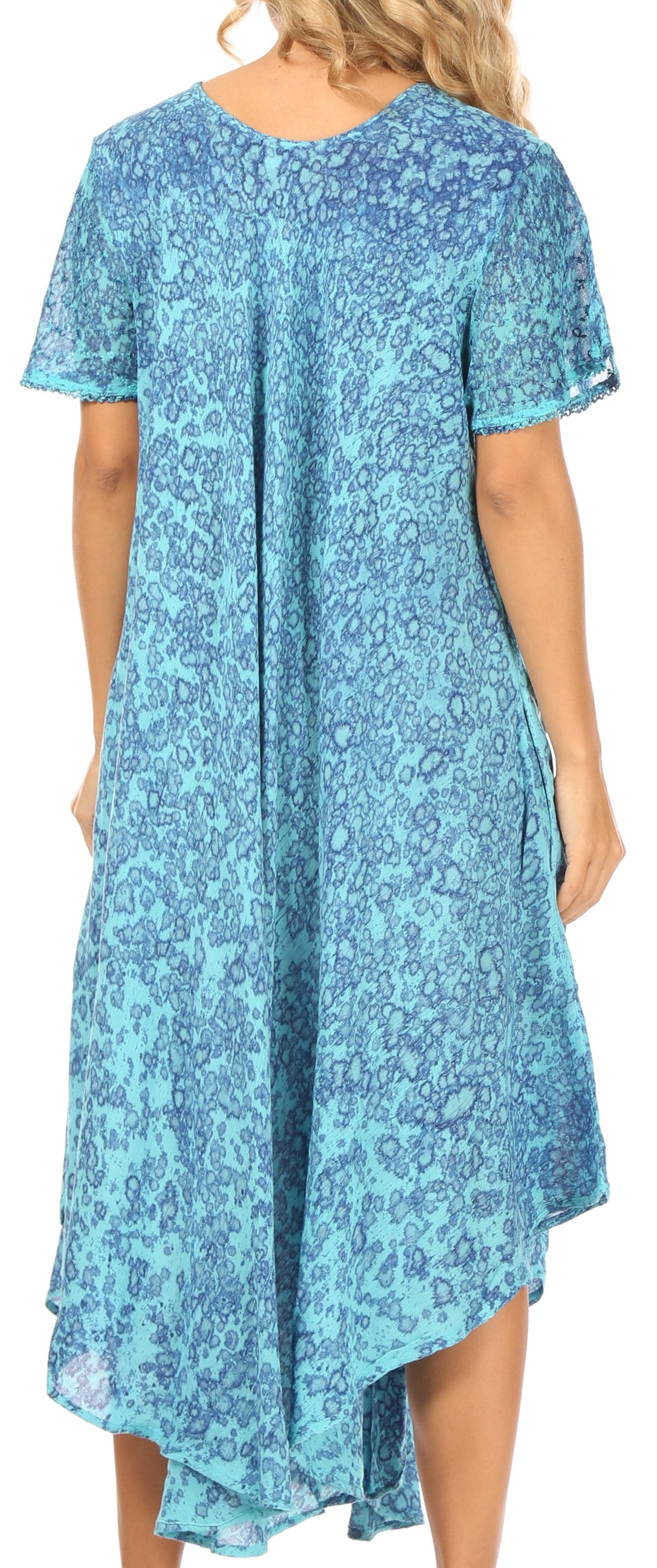 Woman wearing a blue floral dress with a flowing design.