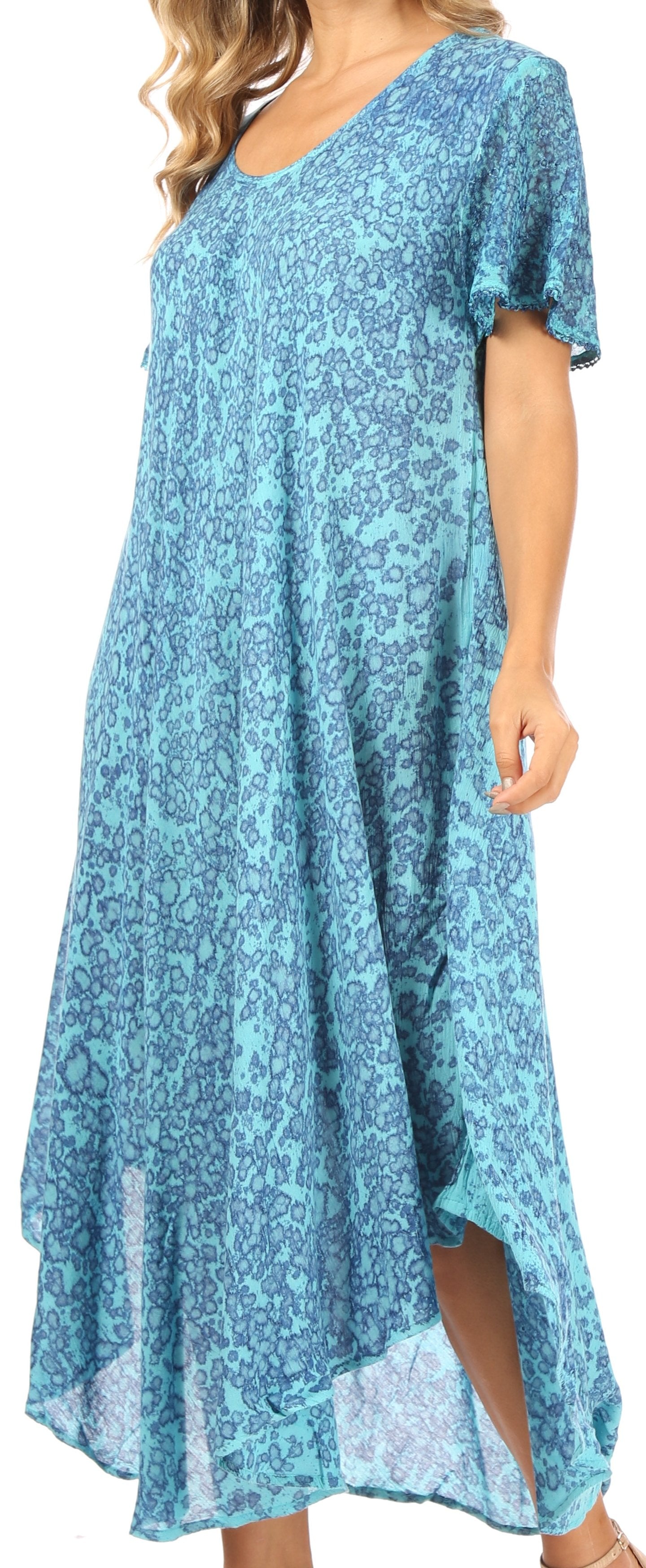 Woman wearing a blue floral dress with a high-low hem.