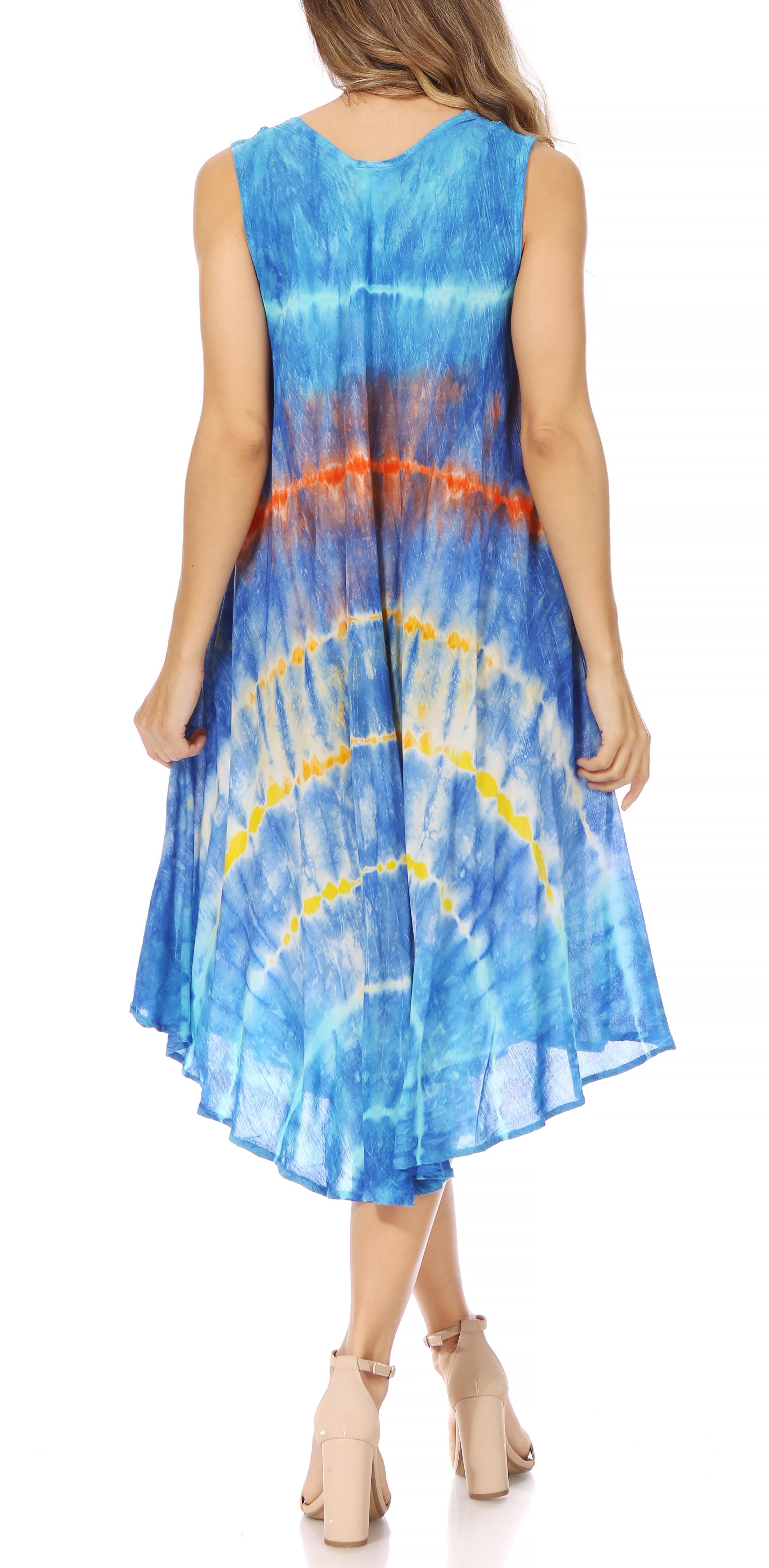 Woman wearing a blue tie-dye dress on a white background