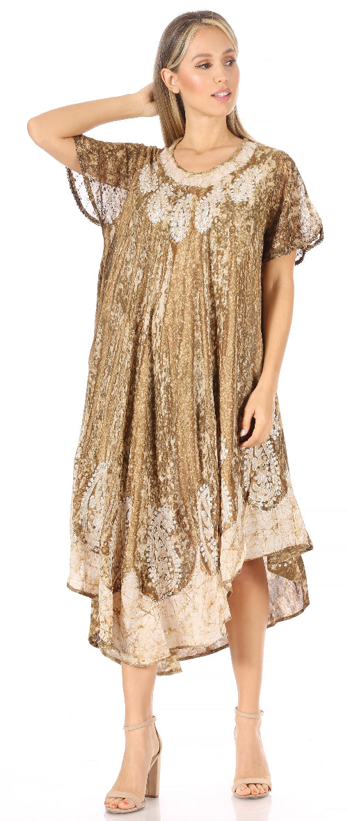 Woman wearing a gold and beige patterned dress on a white background