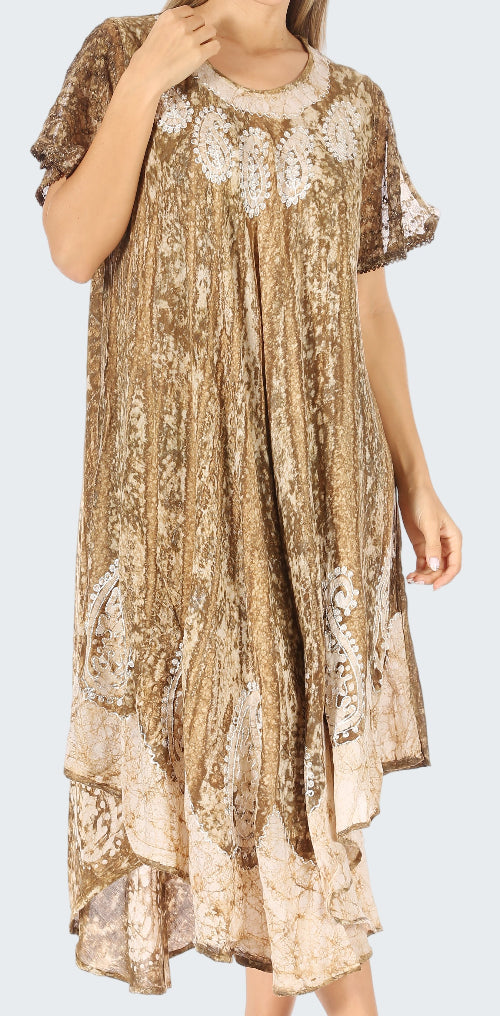 Woman wearing a patterned dress with lace details on a white background