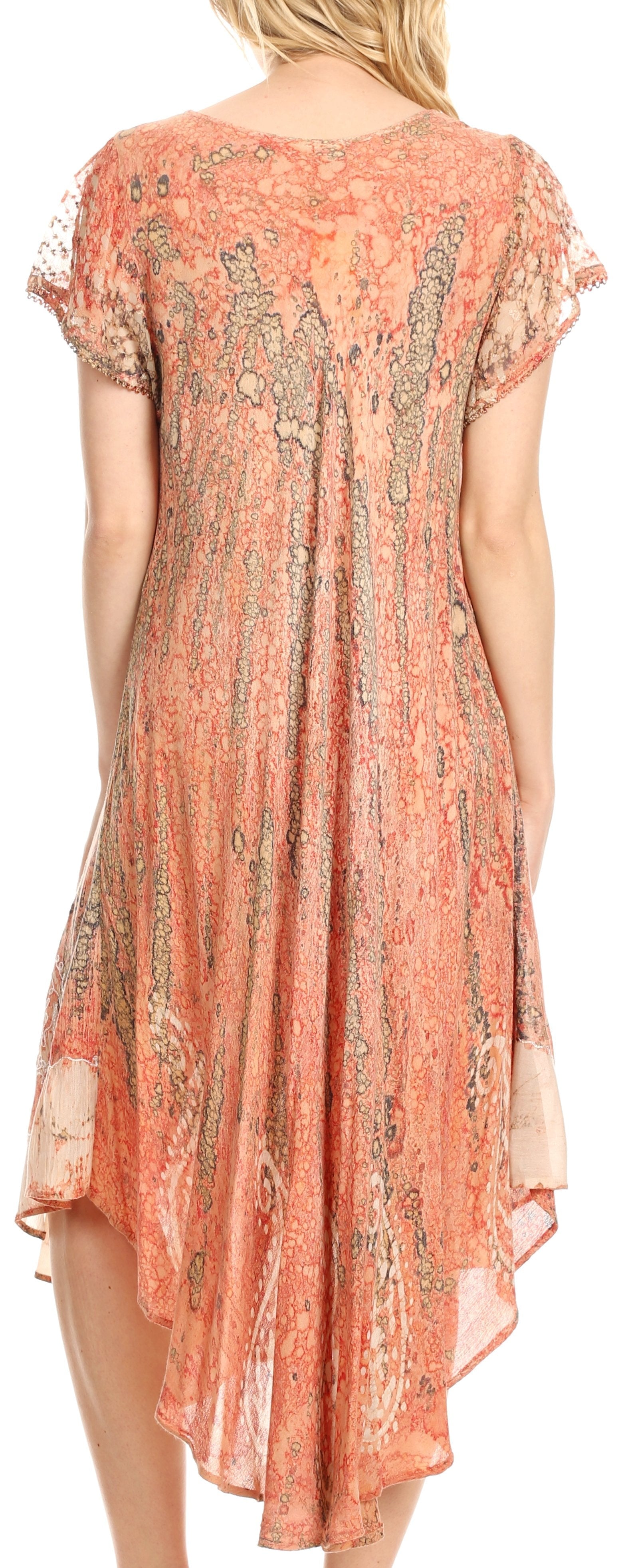 Woman wearing a coral patterned dress with sheer sleeves.