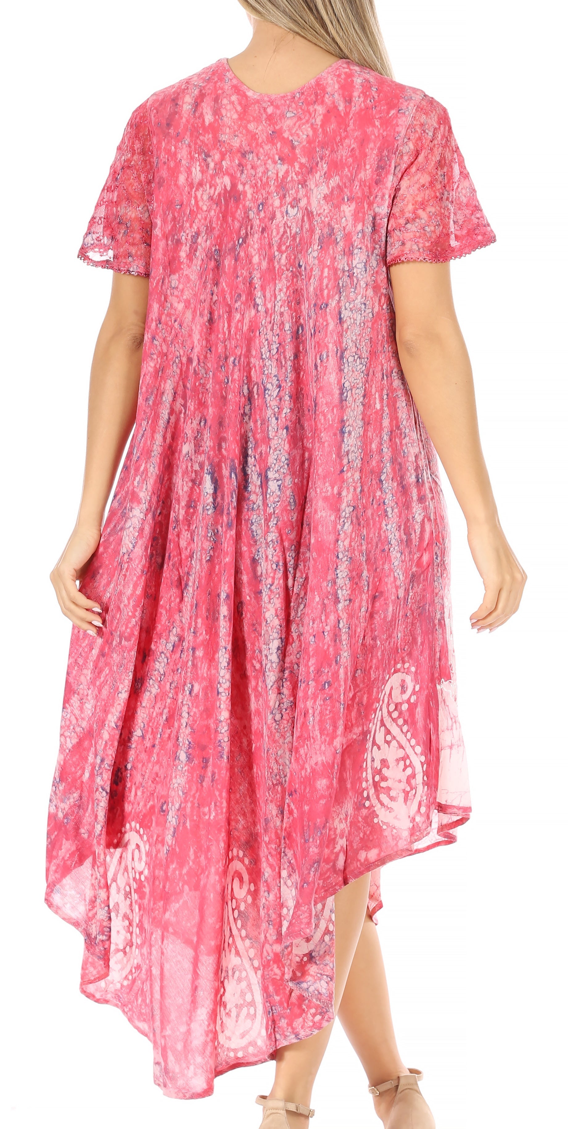 Woman wearing a pink patterned dress on a white background