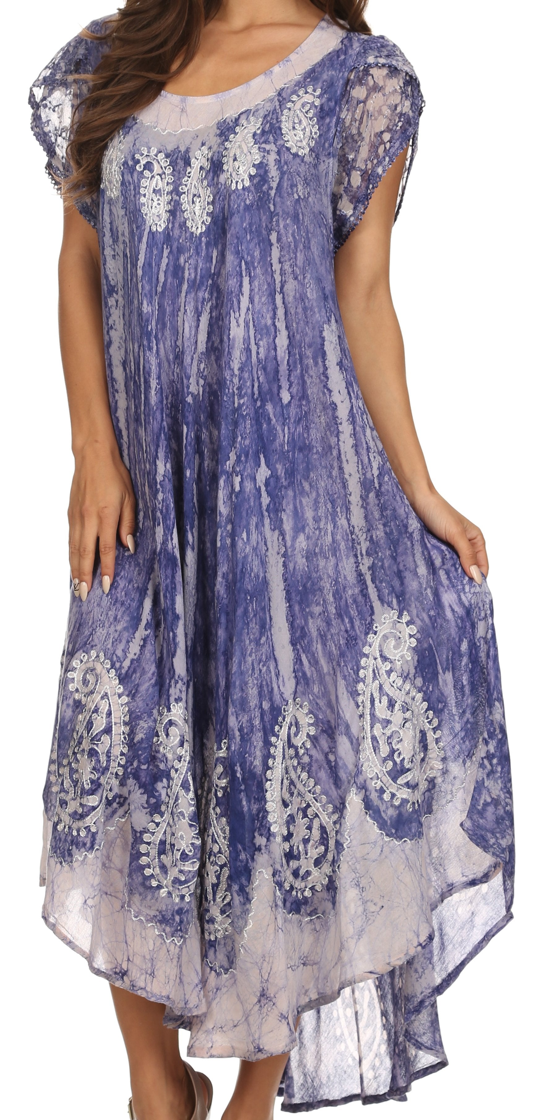 Woman wearing a blue and white patterned dress on a white background