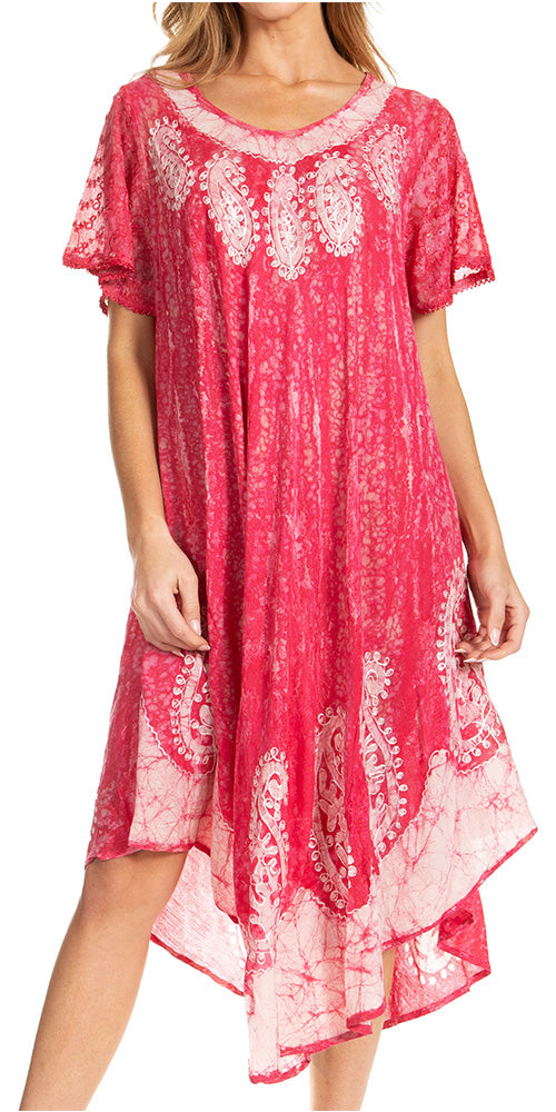 Woman wearing a pink dress with white lace details on a white background