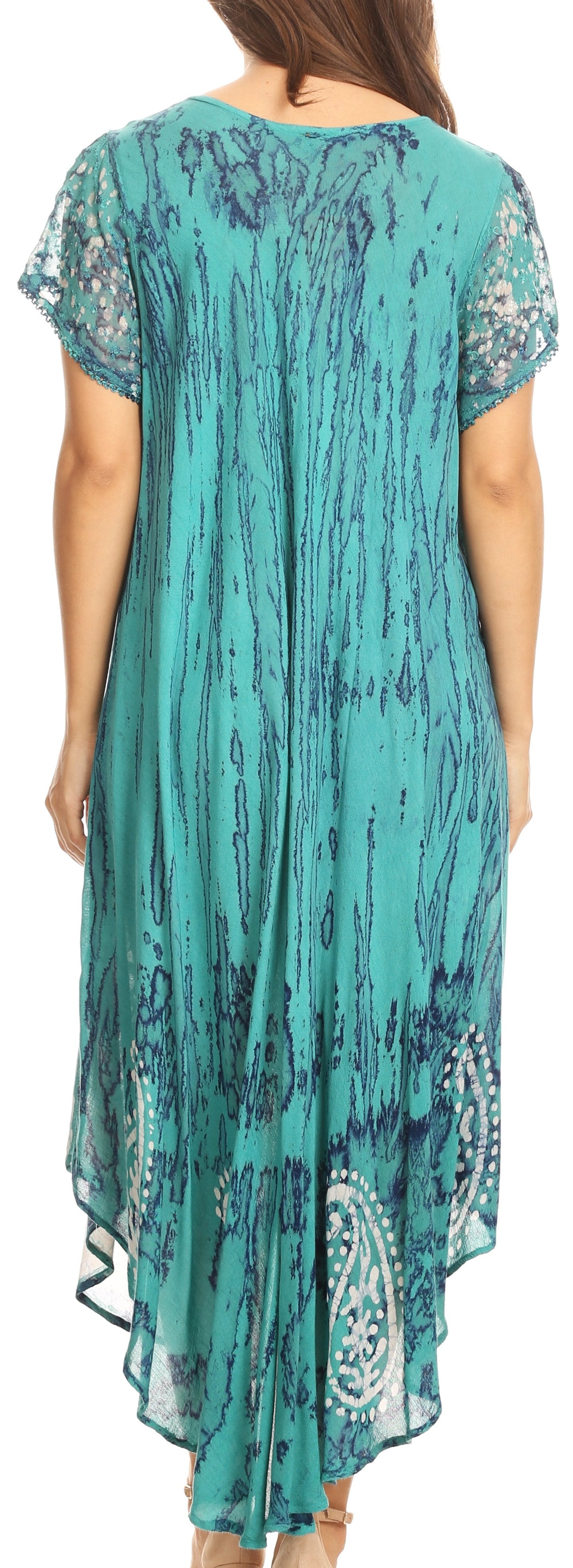 Woman wearing a teal patterned dress with short sleeves.