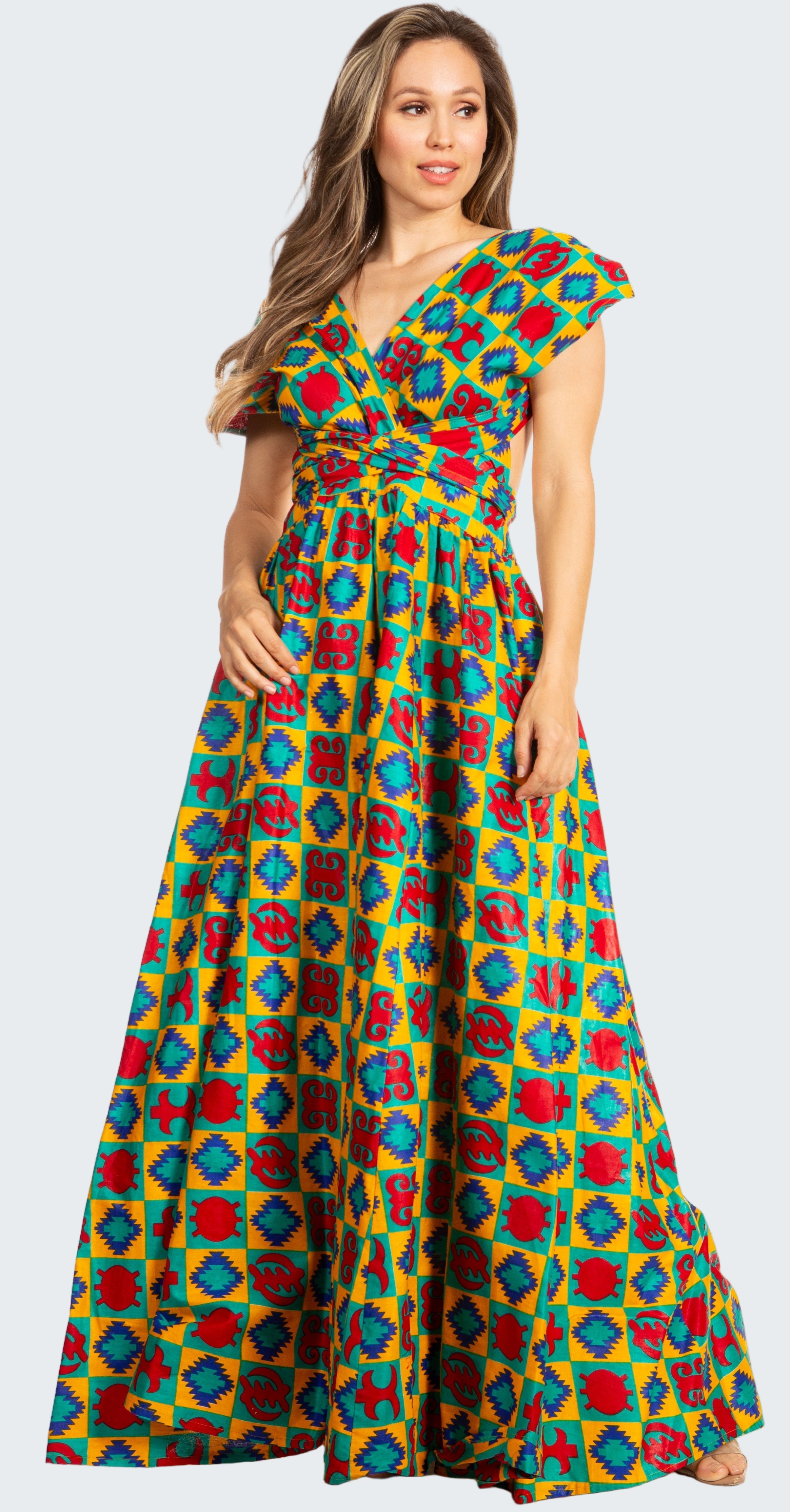 Woman wearing a colorful geometric patterned dress on a white background