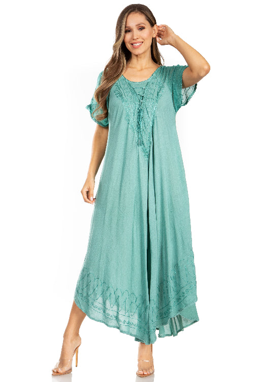 Woman wearing a teal dress on a white background