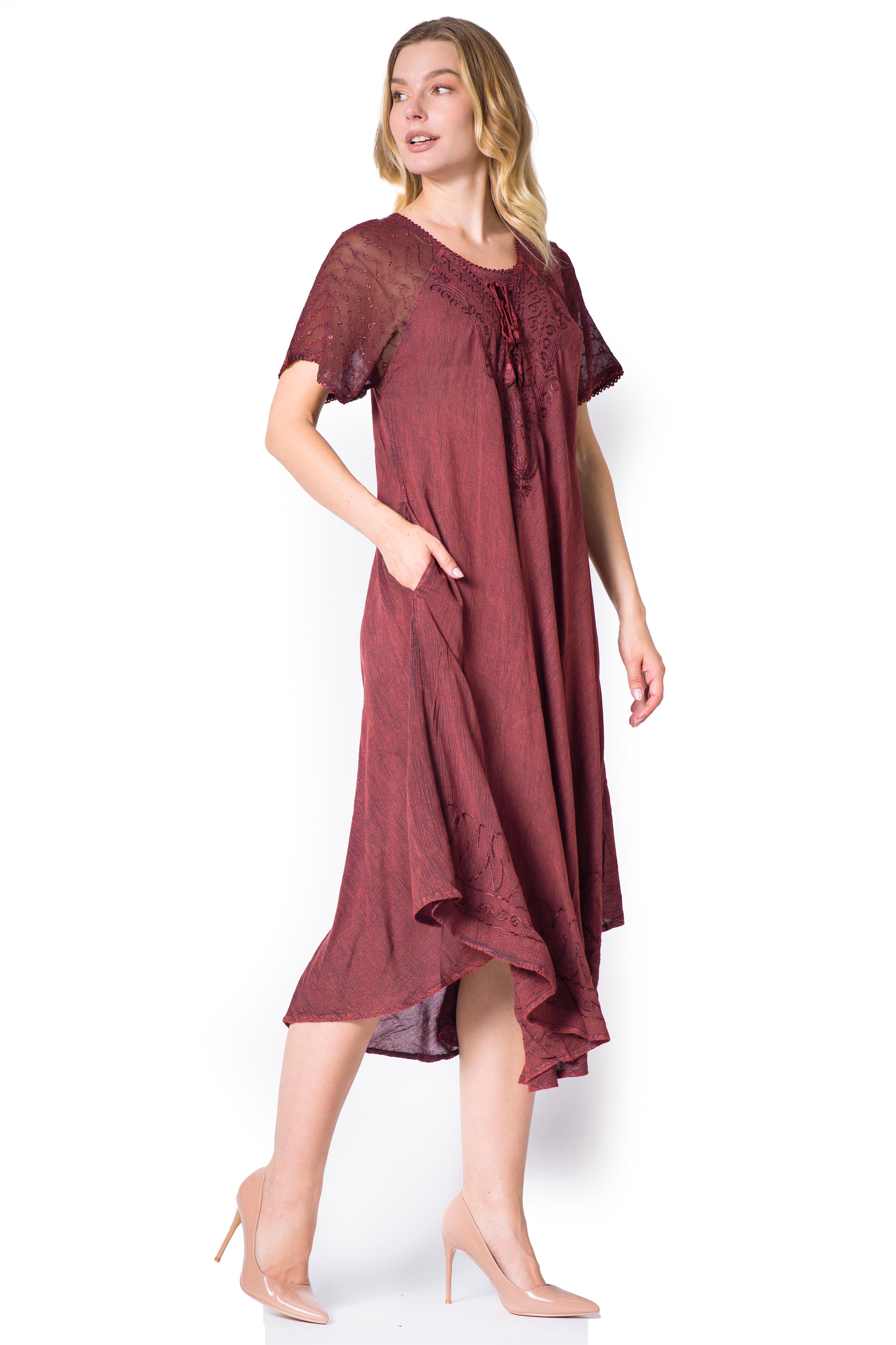 Woman wearing a burgundy dress on a white background