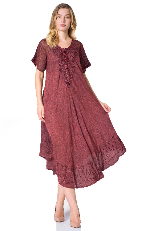 Woman wearing a burgundy dress with lace details on a white background