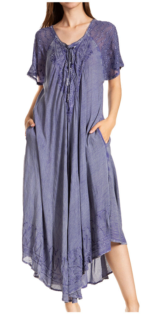 Woman wearing a long, short-sleeve purple dress with lace details on a white background