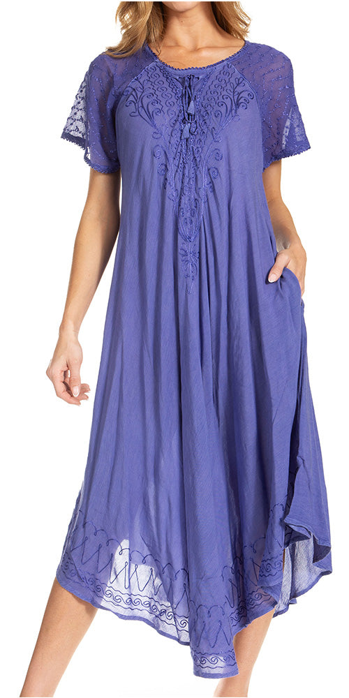 Woman wearing a purple dress with lace details on a white background