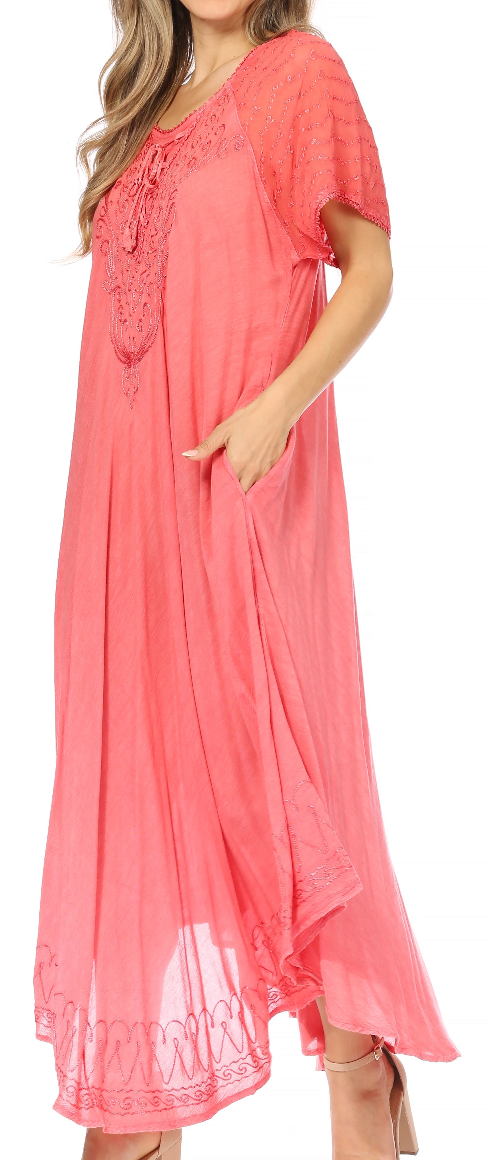 Coral dress with lace details on a plain background