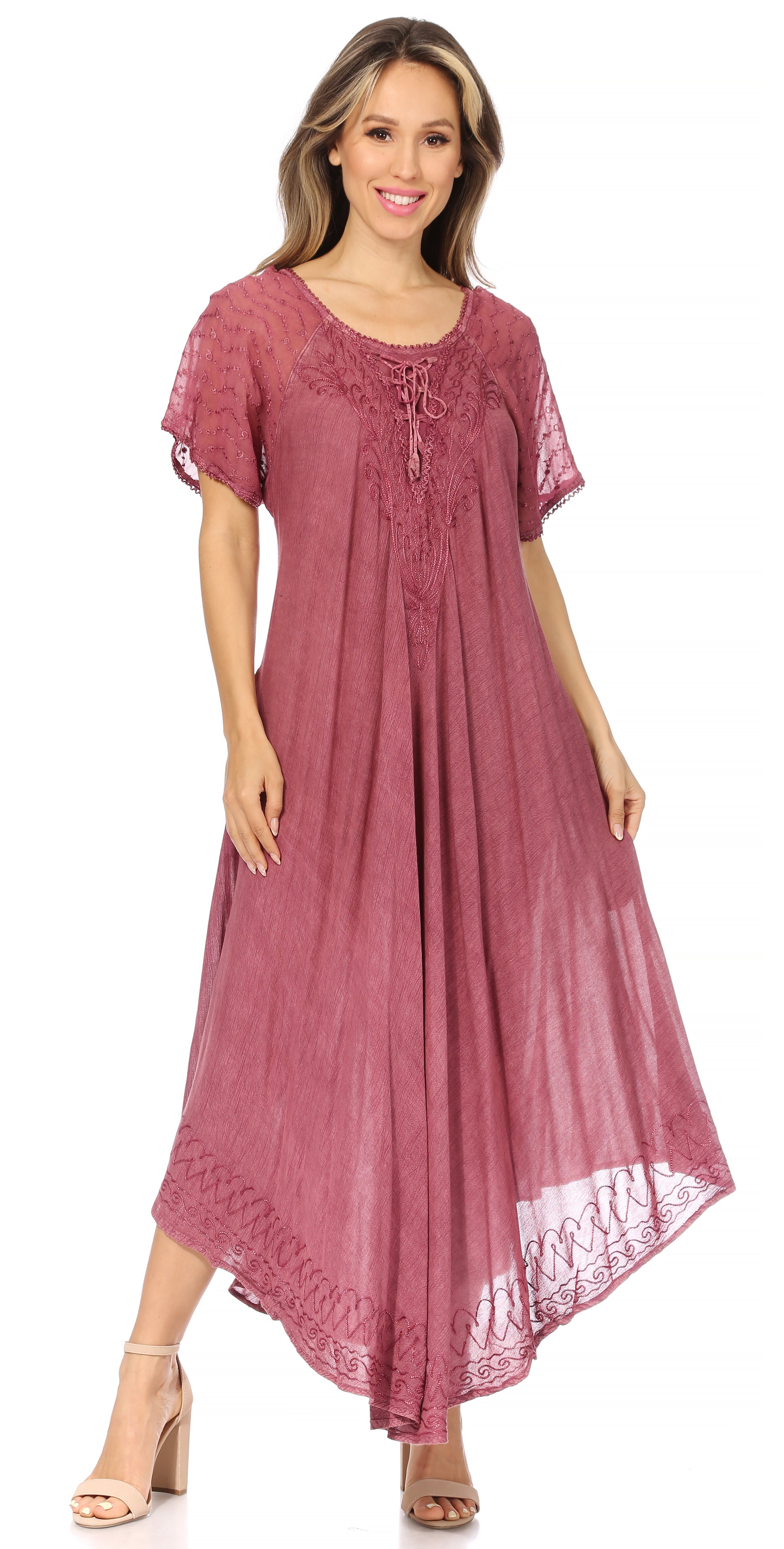 Woman wearing a long burgundy dress with lace details on a white background