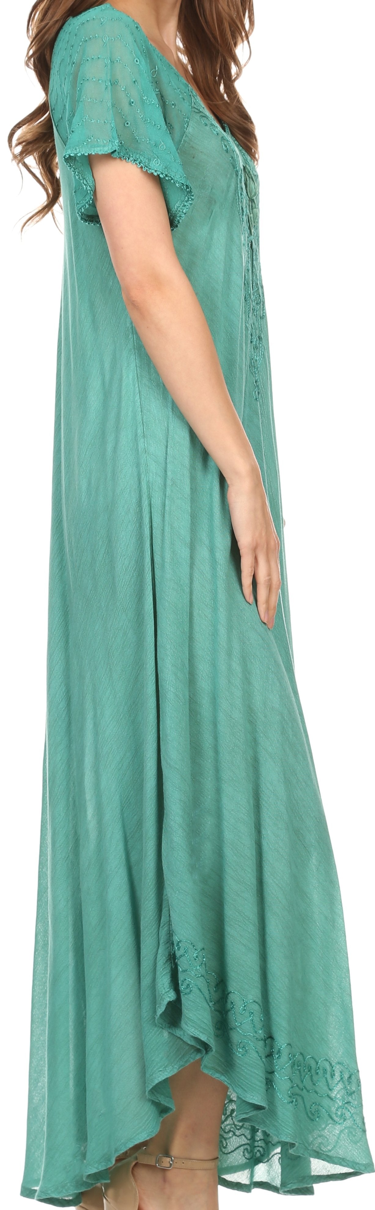 Woman wearing a teal maxi dress on a white background