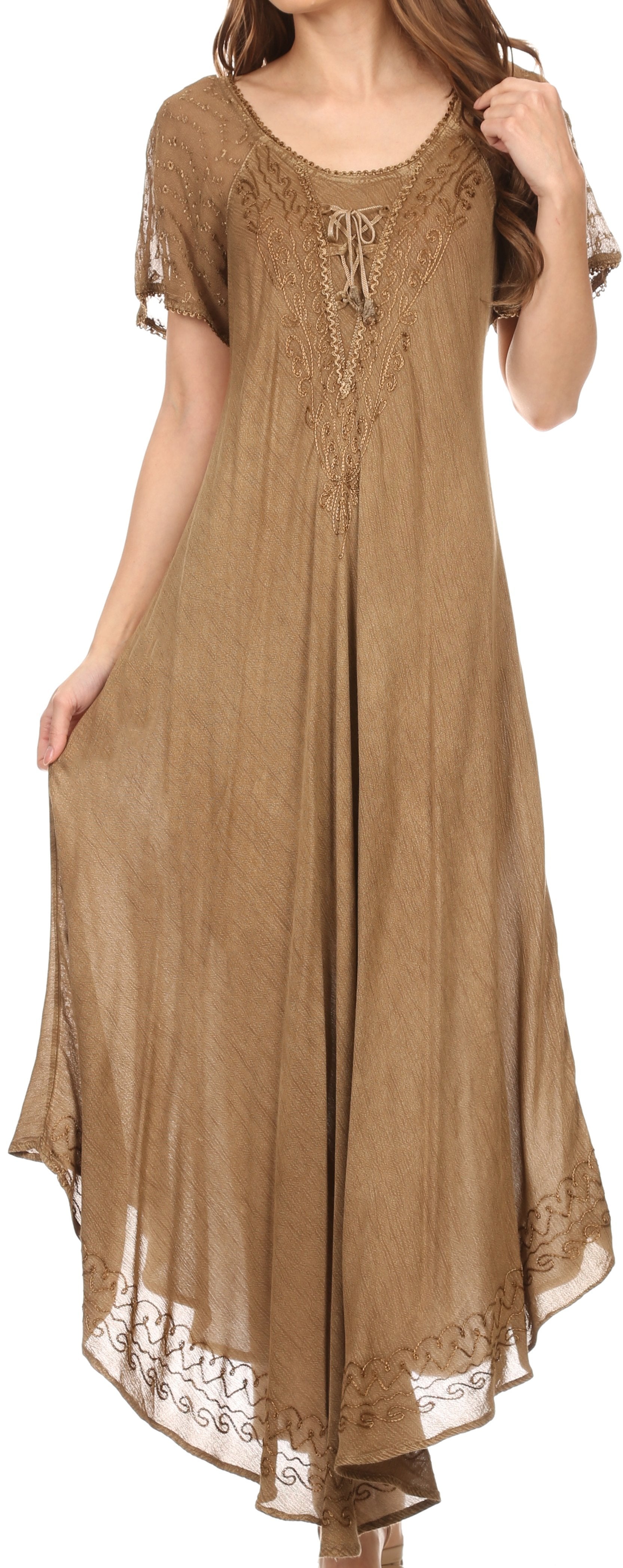 Woman wearing a long brown dress with lace details on a white background