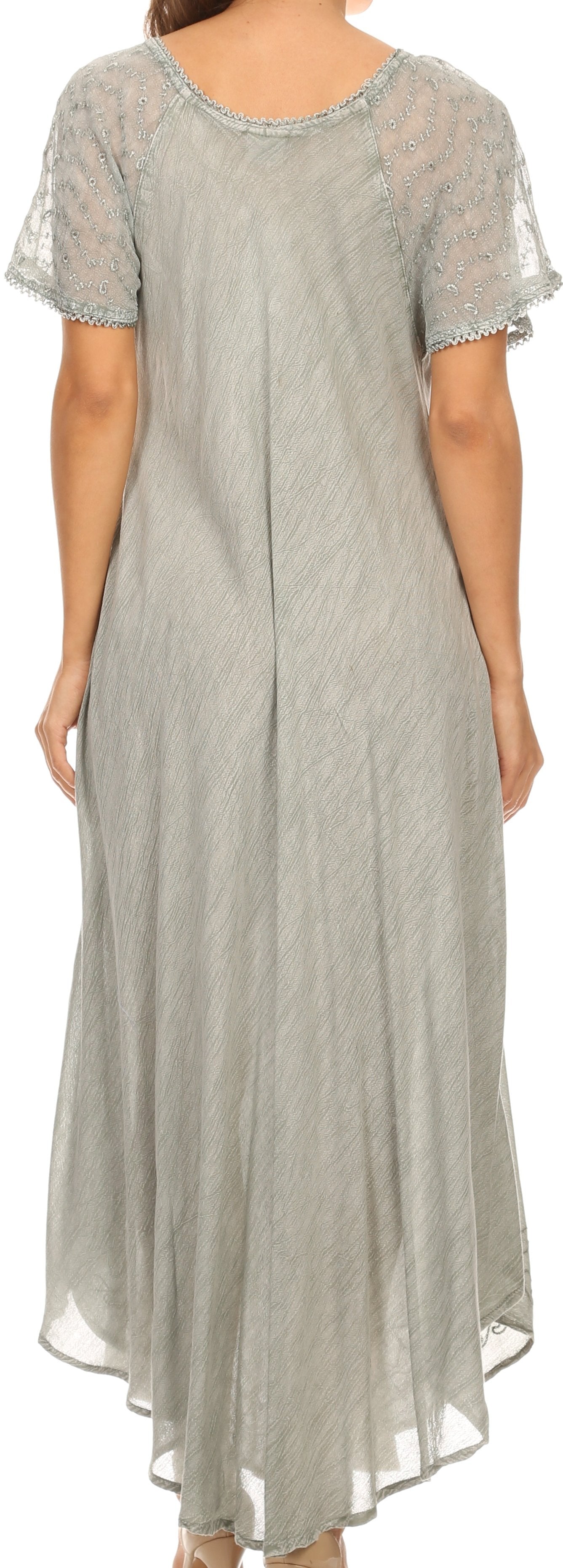 Long light gray dress with lace details on a plain background