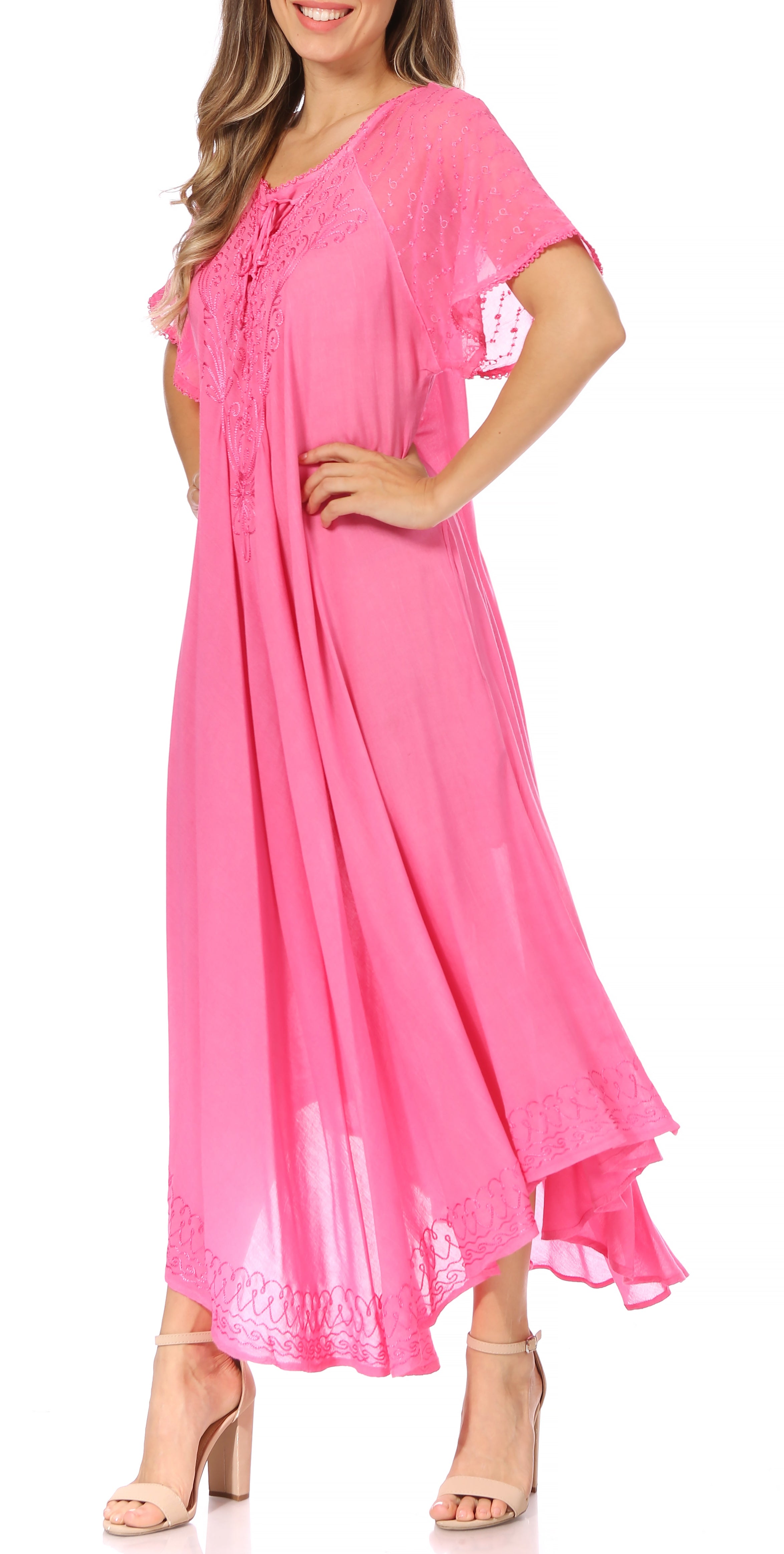 Woman wearing a pink dress with a white background