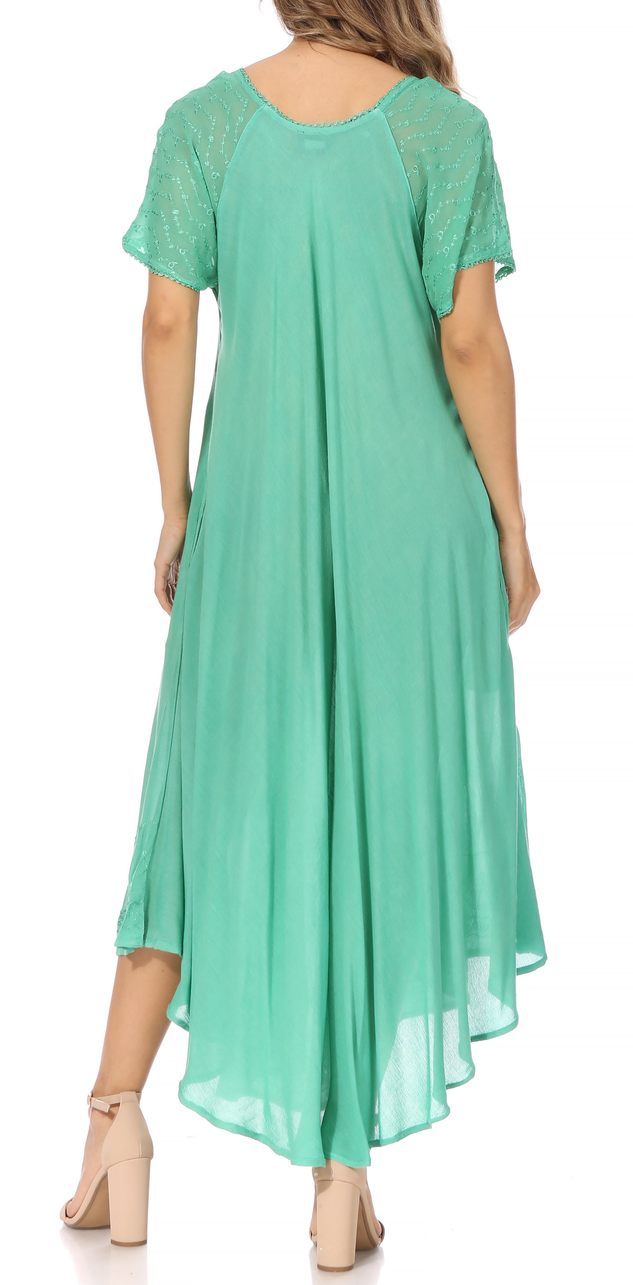 Mint green dress with lace sleeves on a white background