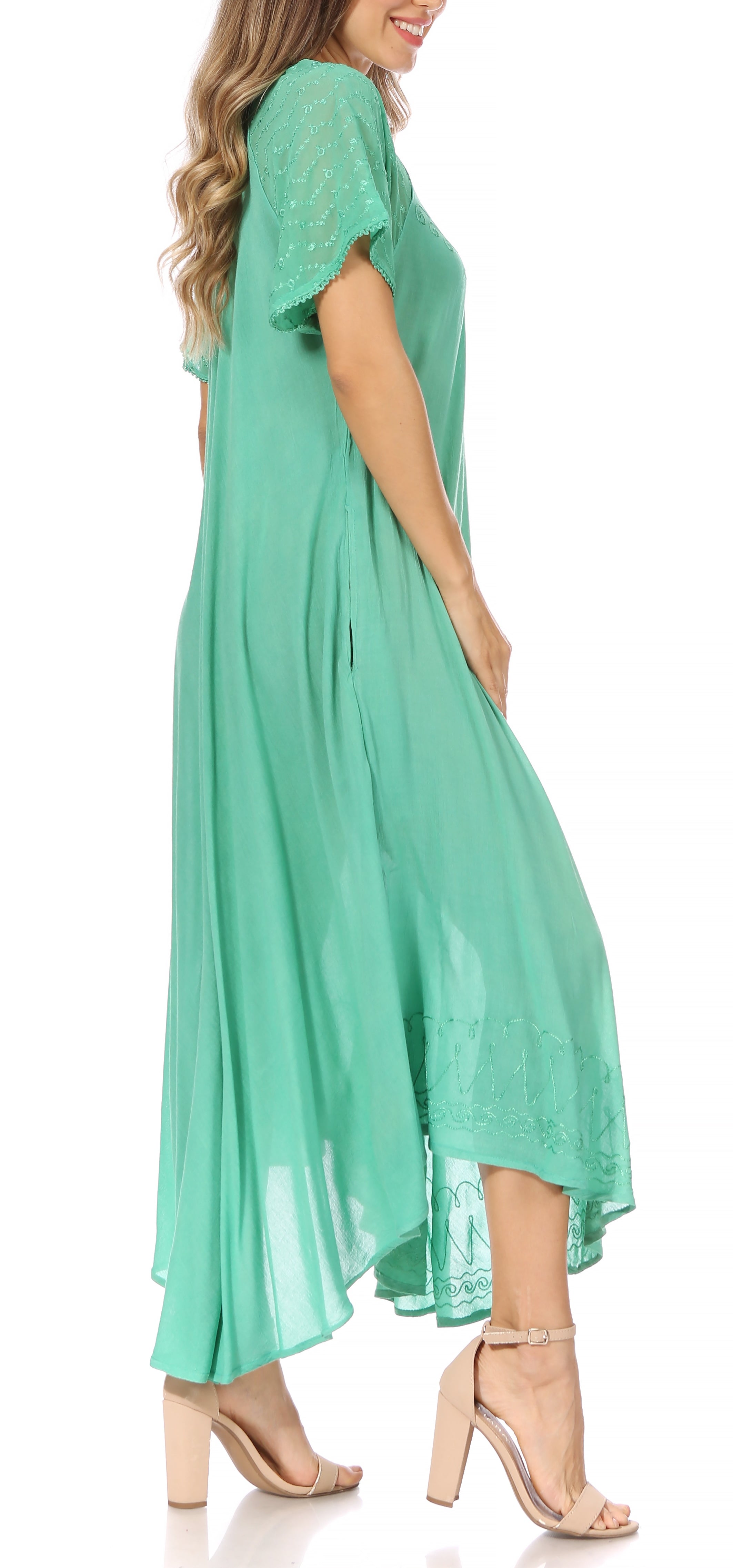 Woman wearing a mint green dress on a white background