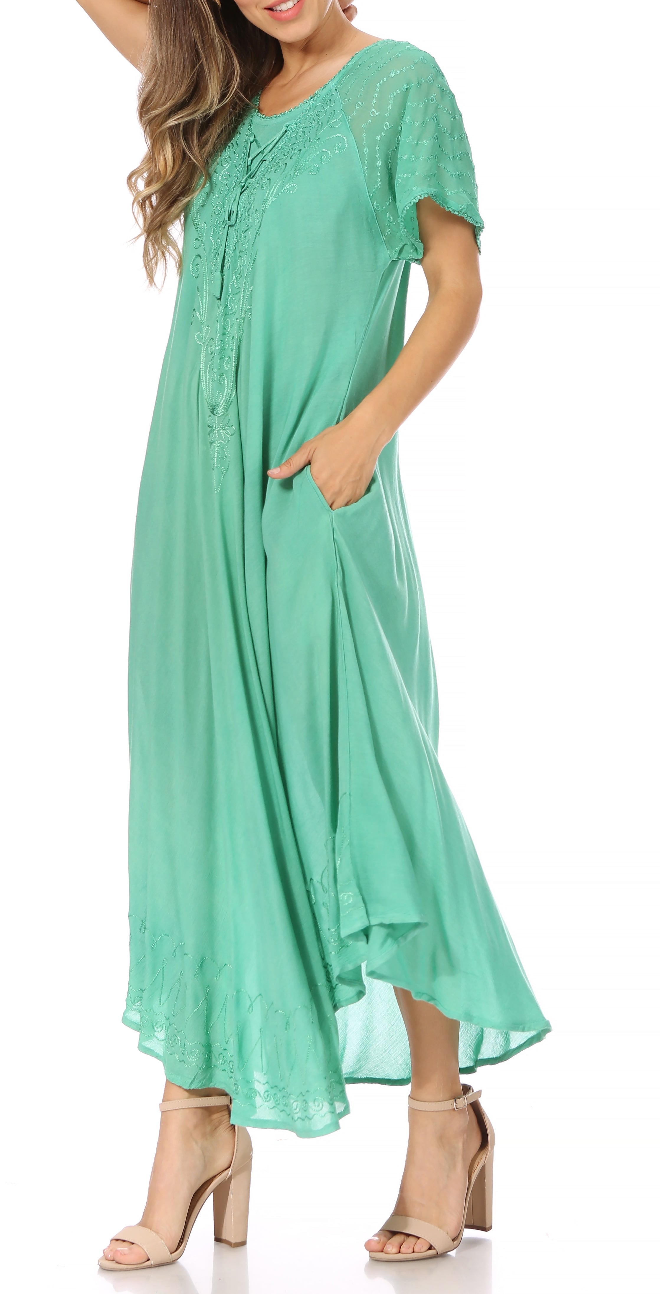 Woman wearing a green dress on a white background