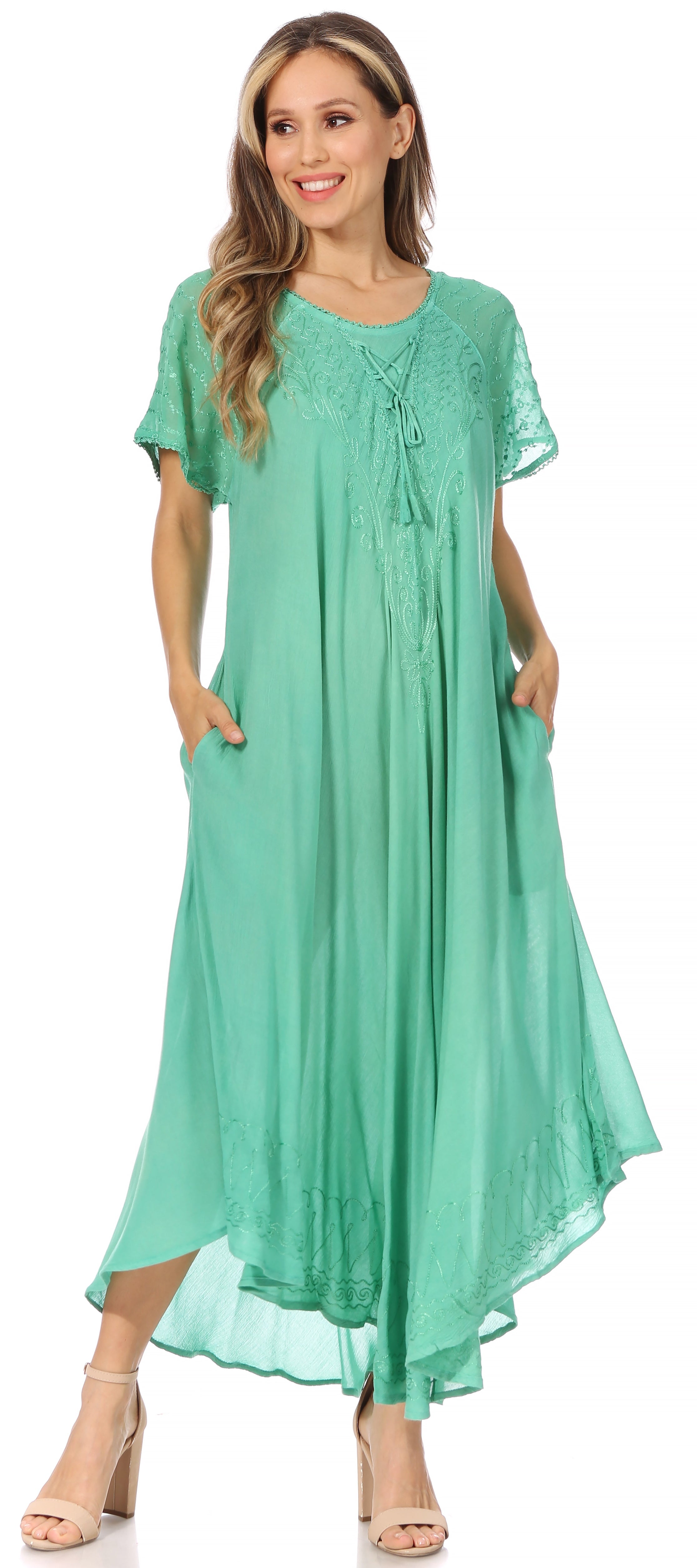 Woman wearing a green dress on a white background