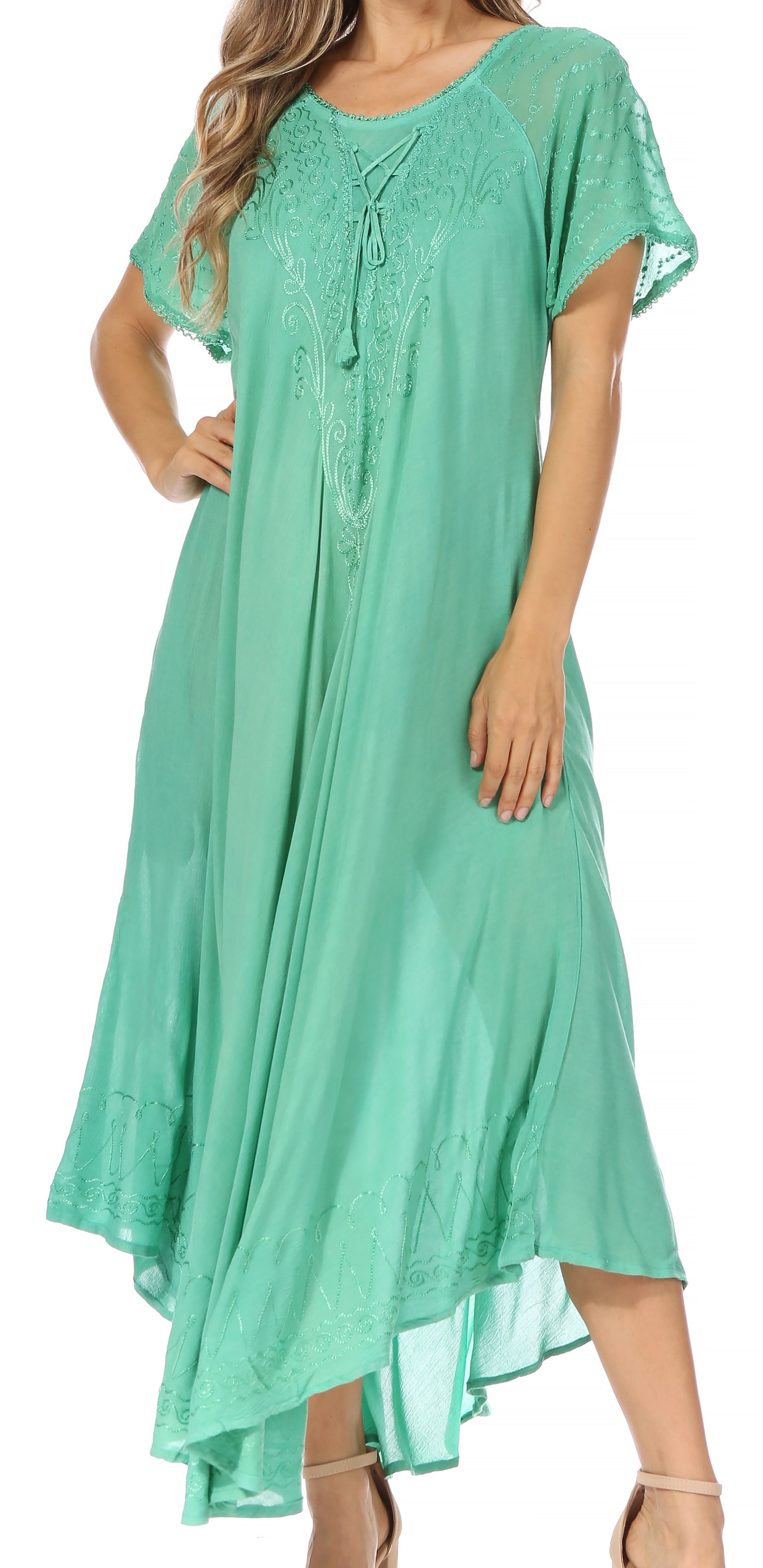 Woman wearing a green dress with a white background