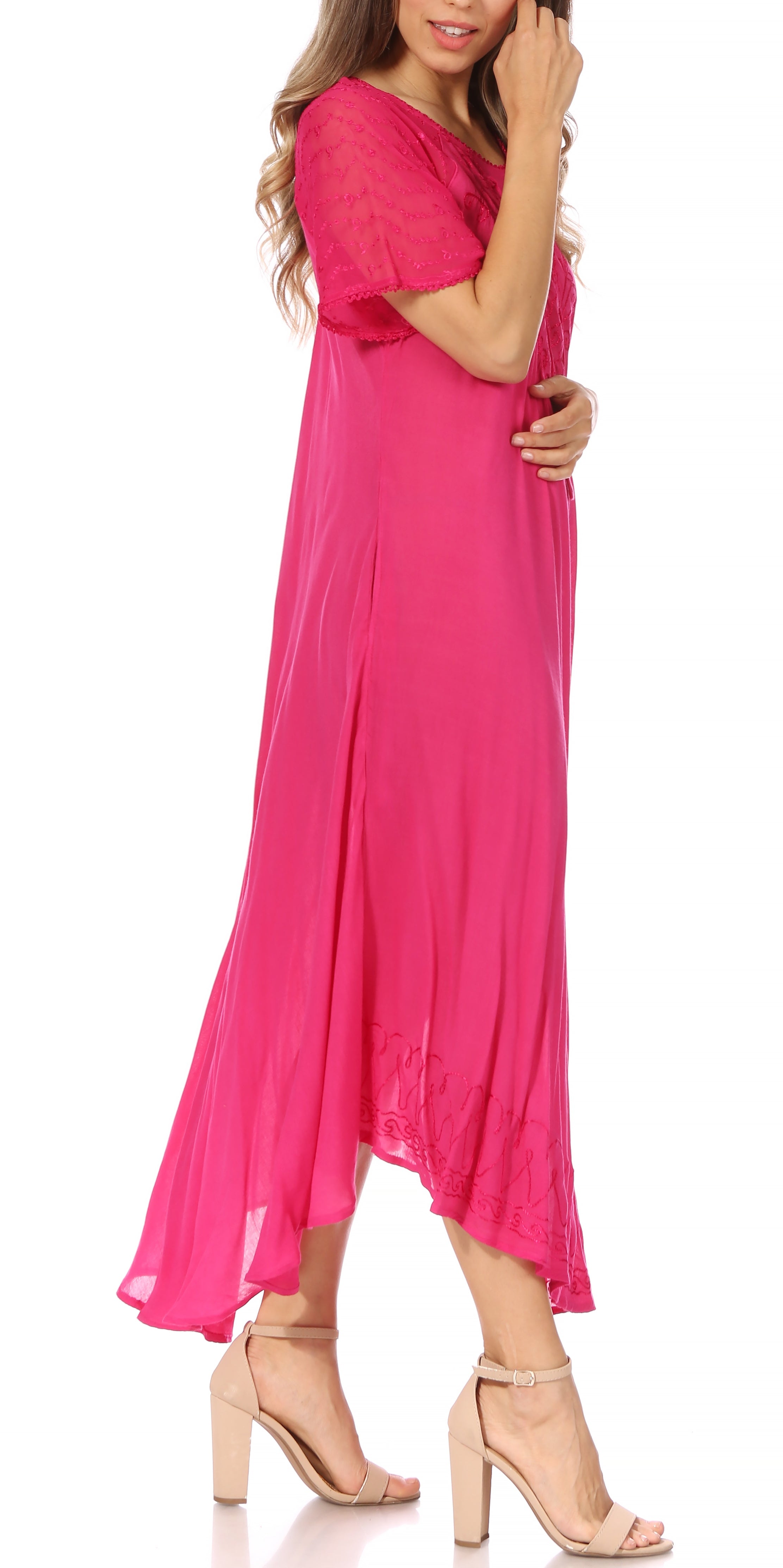 Woman wearing a bright pink dress on a white background