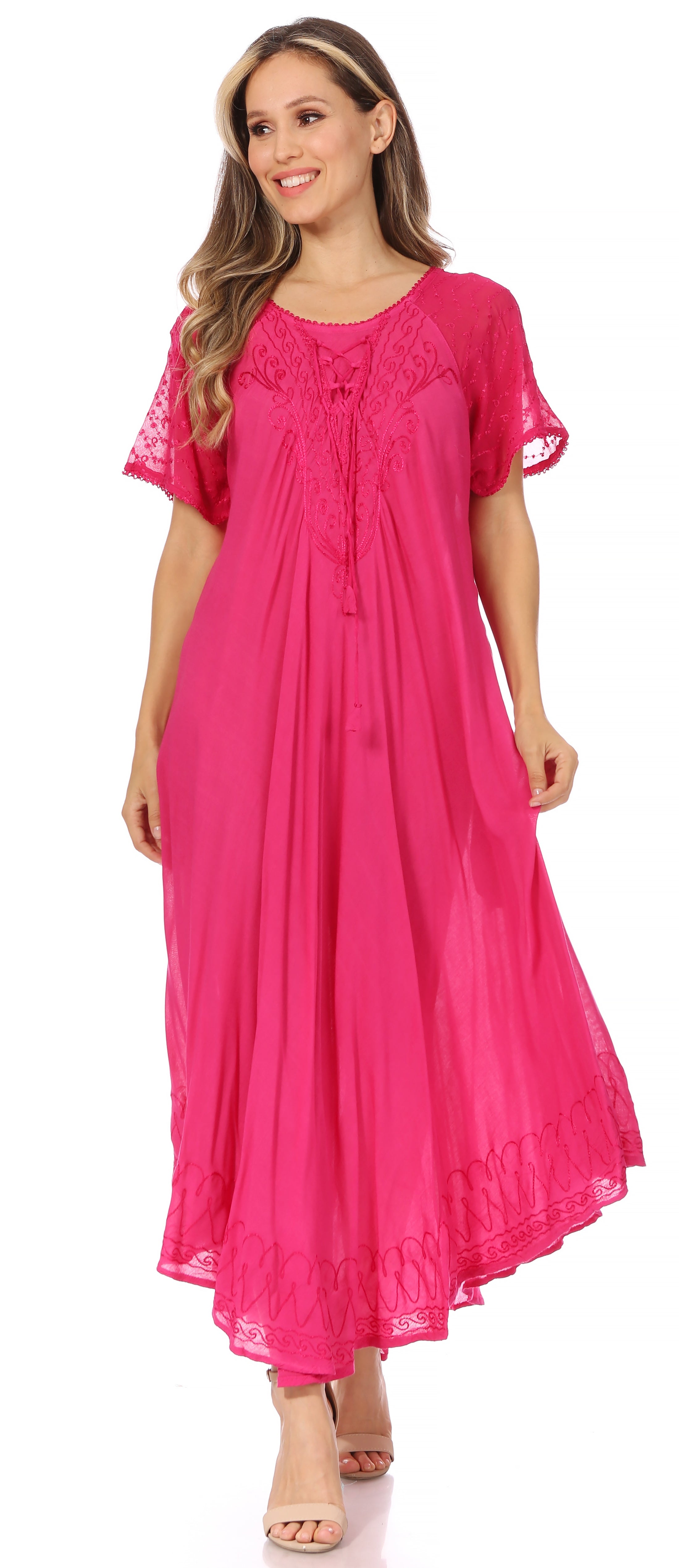 Woman wearing a bright pink dress with short sleeves on a white background