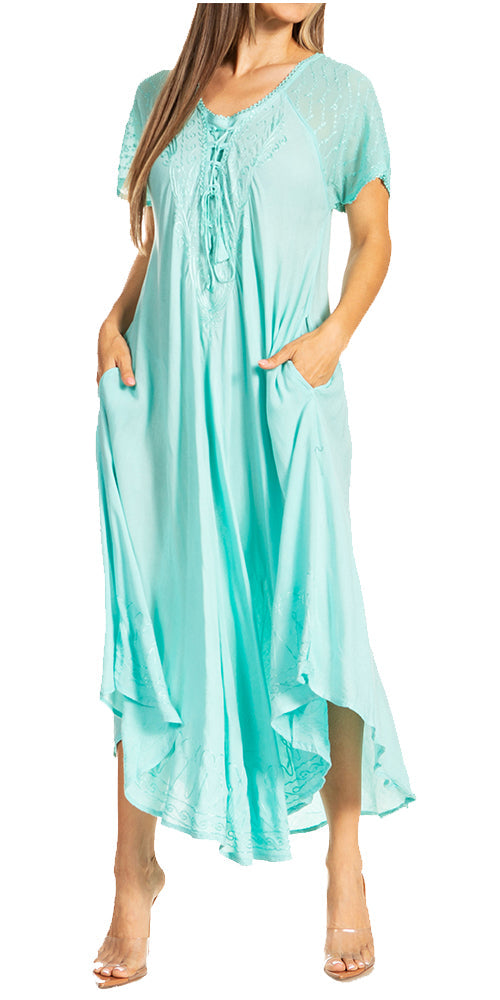 Woman wearing a light blue dress with short sleeves and a high-low hem on a white background