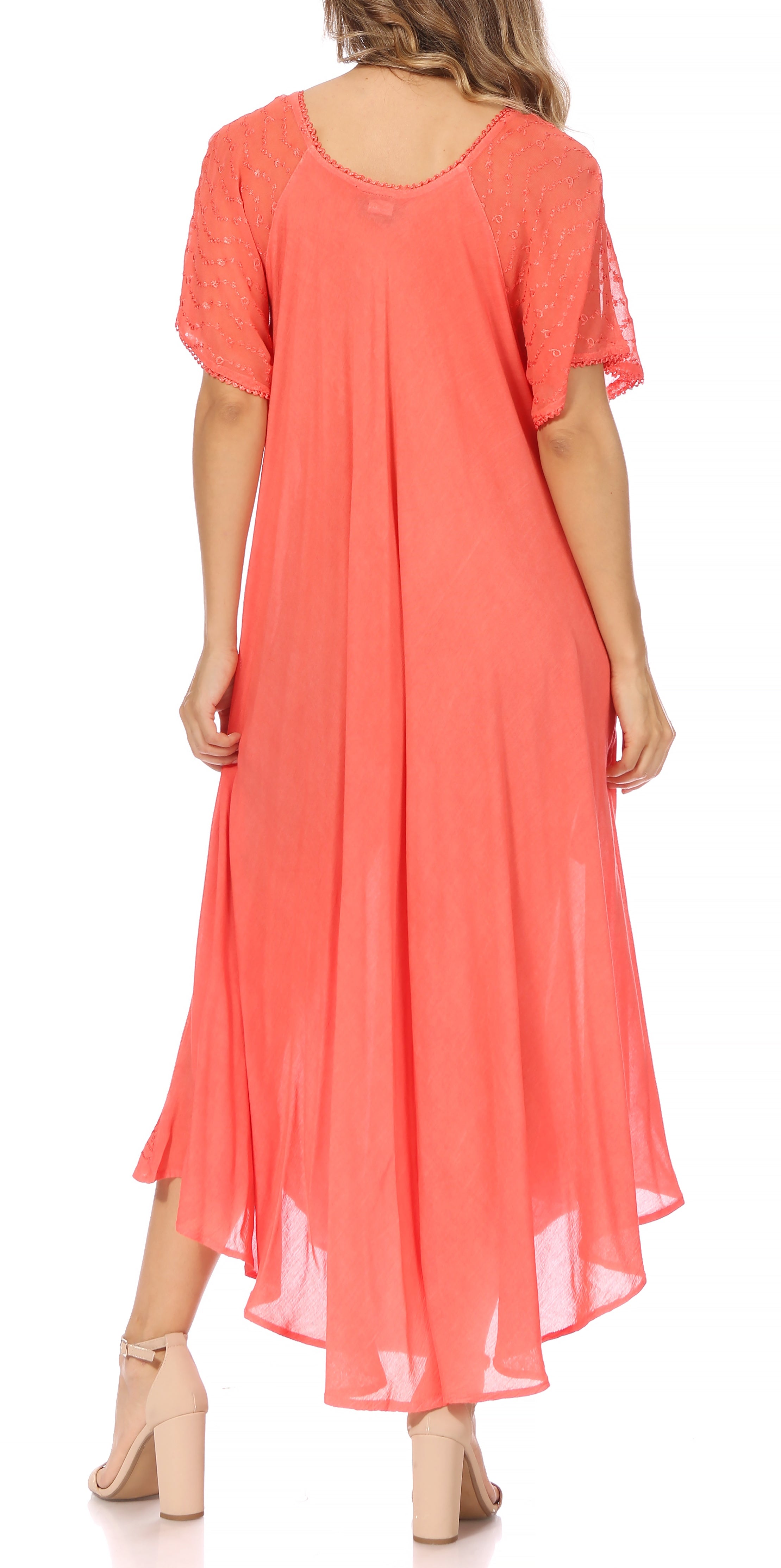 Coral dress worn by a model on a white background