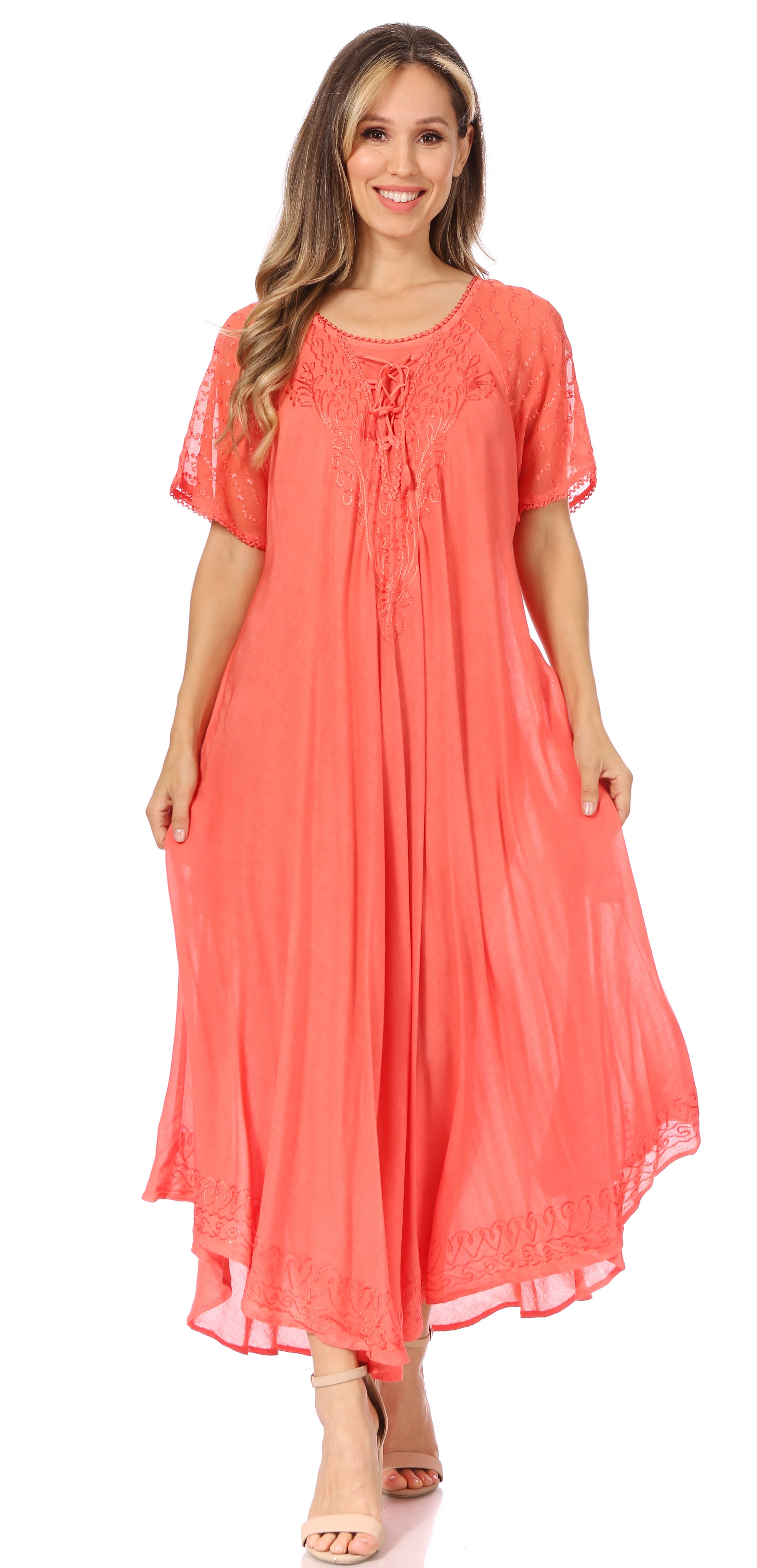 Woman wearing a coral dress on a white background