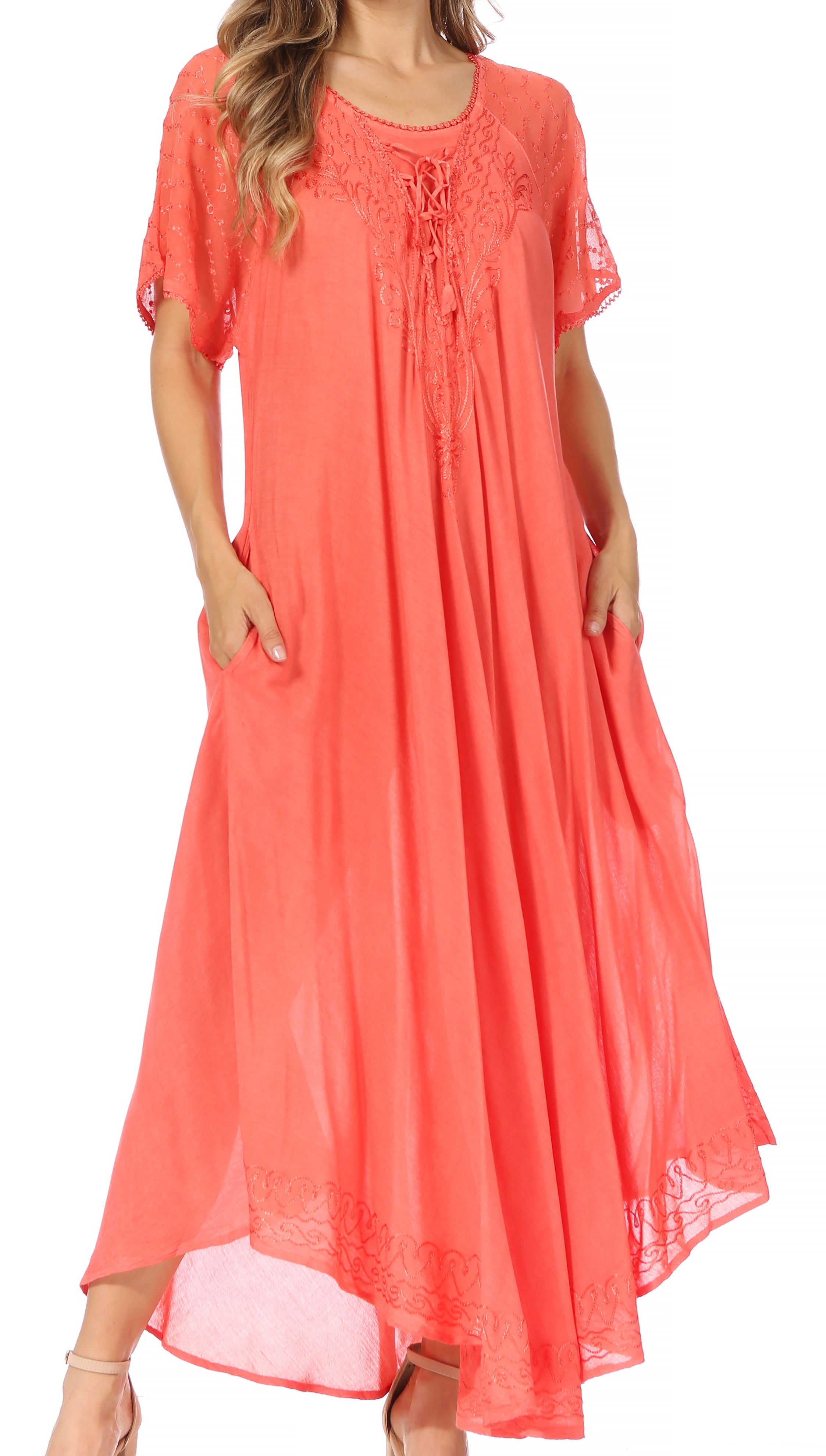 Coral dress with lace details on a white background