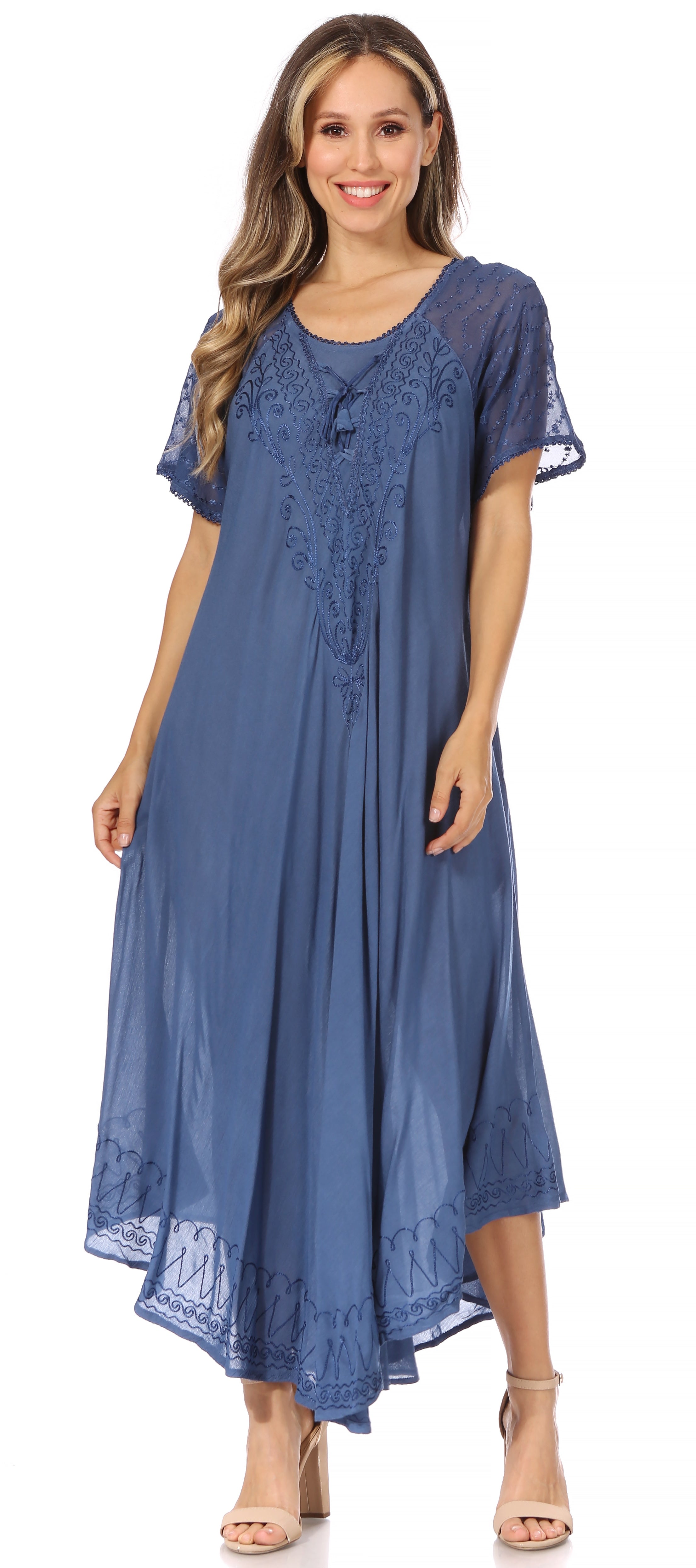 Woman wearing a blue lace dress on a white background