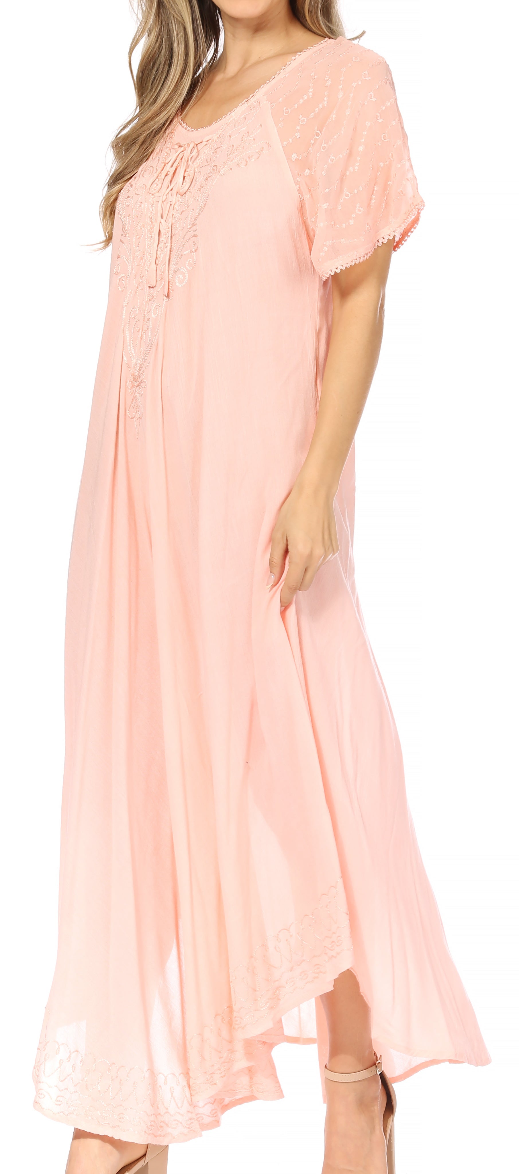 Woman wearing a light pink dress on a white background